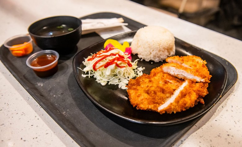 chicken katsu and cabbage on a cafeteria tray at H Mart