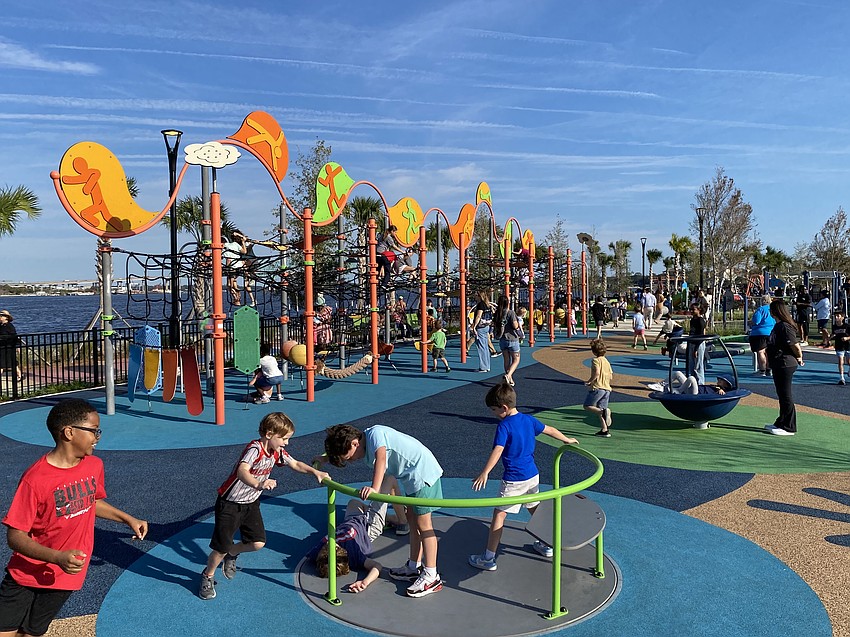 Children play Nov. 24 at RiversEdge public parks on the Downtown Jacksonville Southbank. It is the site of the former site of the JEA Southside Generating Plant, which operated from 1947 to 2001.