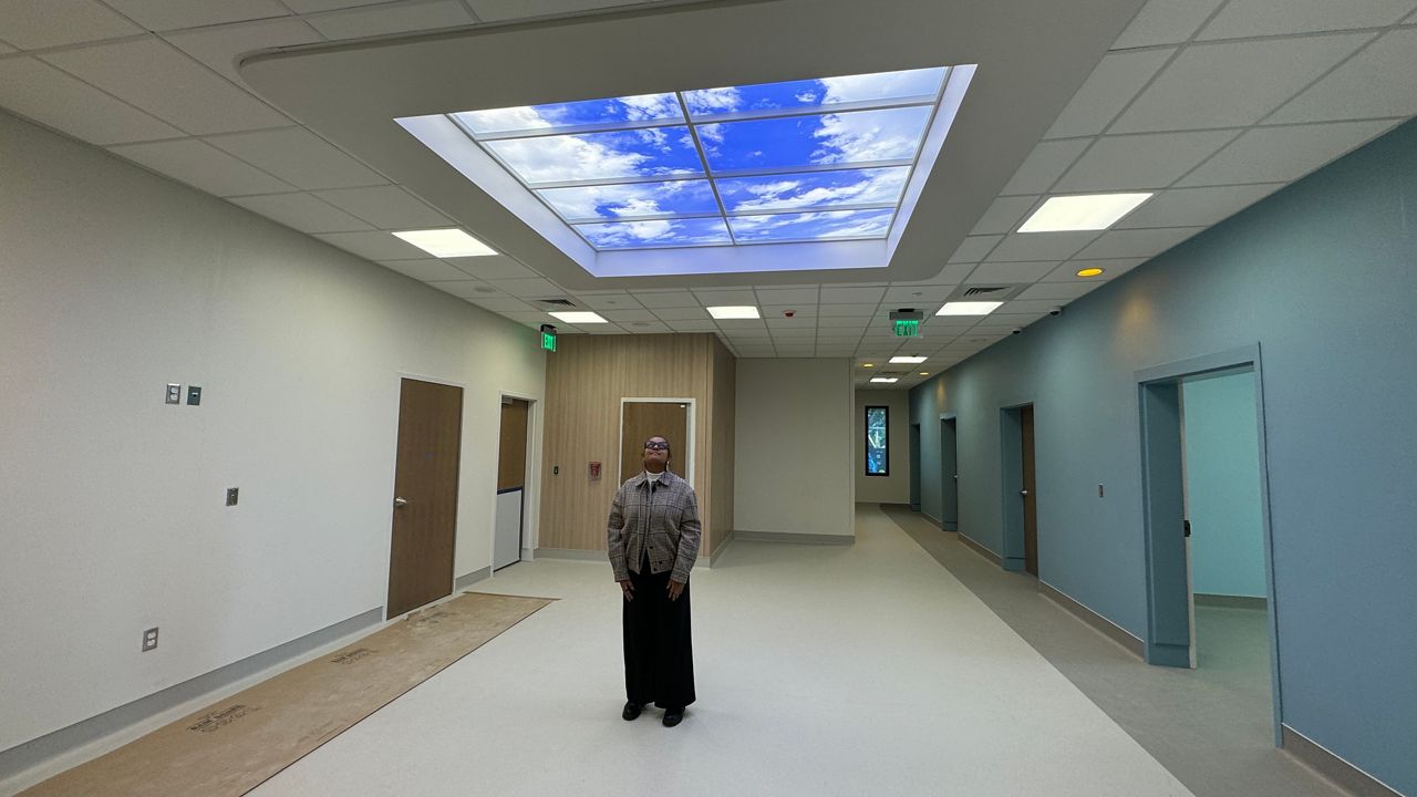 Licensed Clinical Social Worker, Cassandra Castro shows the facility under construction   Photo: Melissa Eichman
