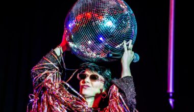 Photo of a woman holding a disco ball
