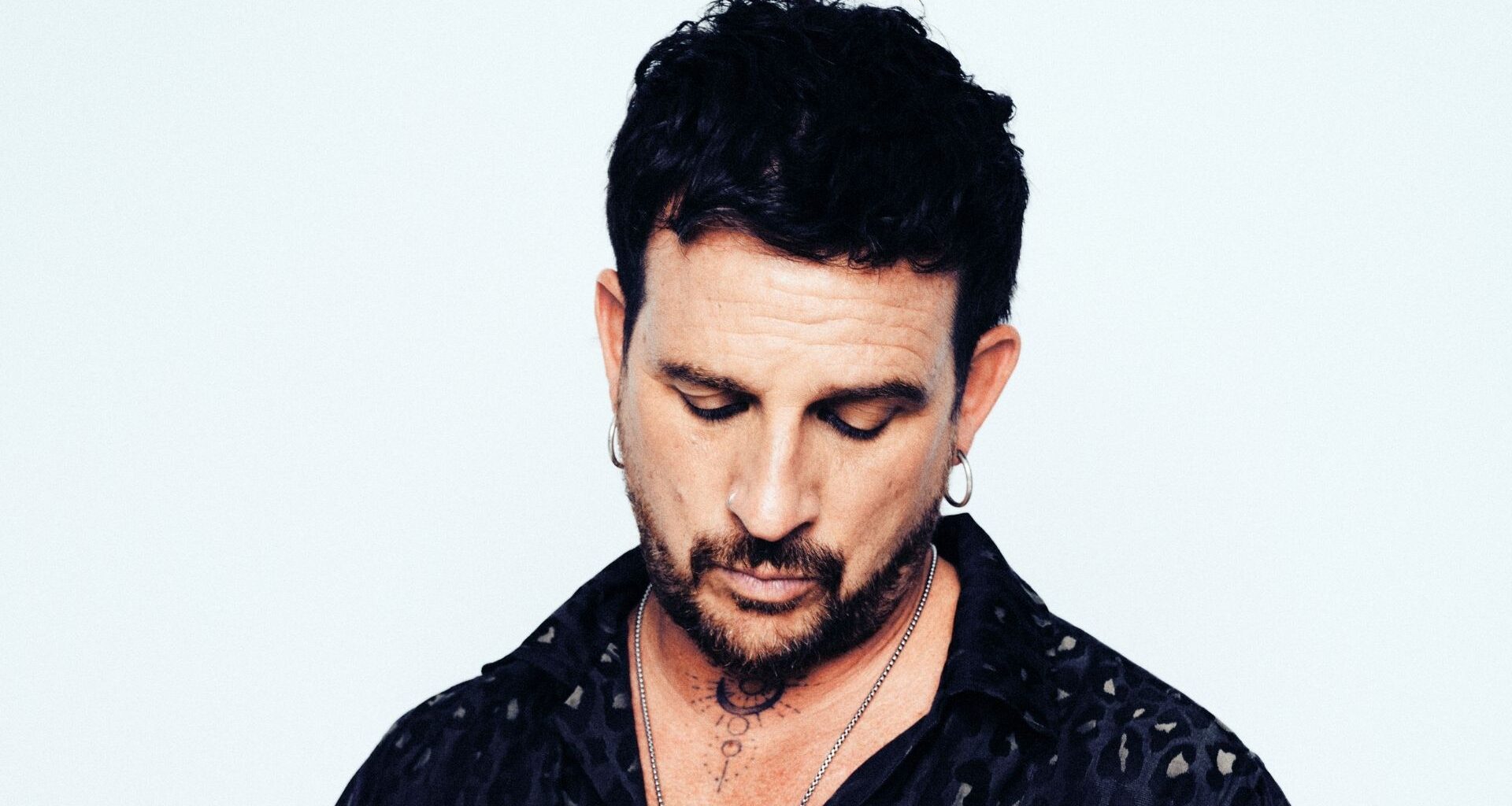 Photo of a man looking down.