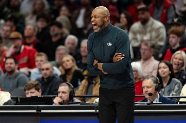 Orlando Magic head coach Jamahl Mosley yells during the second half of an NBA basketball game against the Portland Trail Blazers, Tuesday Dec. 23, 2025, in Portland, Ore. (AP Photo/Howard Lao)