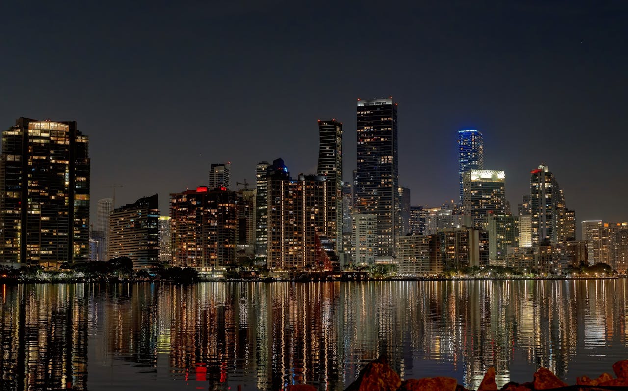 water in the foreground shows a rippling reflection of the skyscrapers above