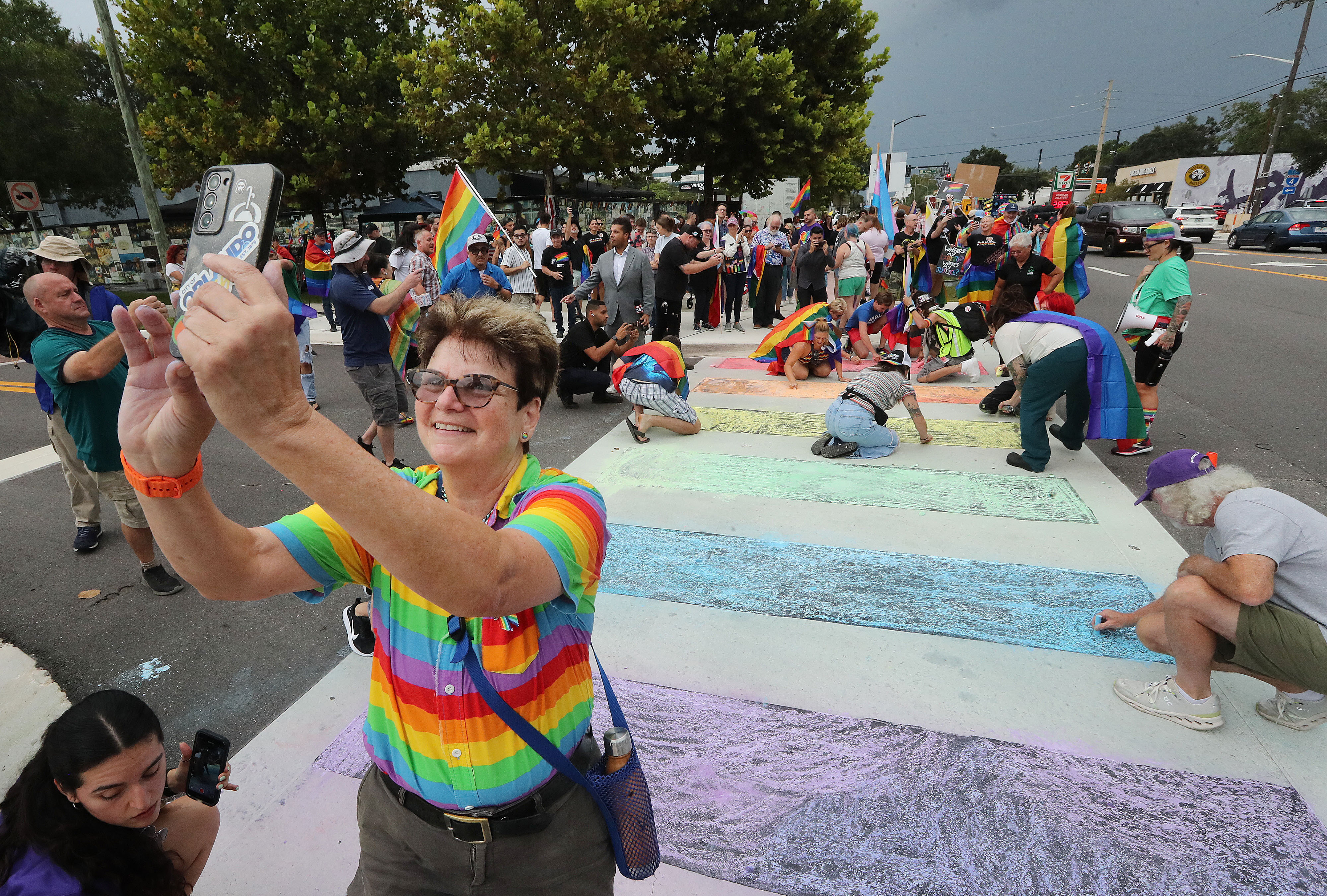 Orlando City Commissioner Patty Sheehan, left, smiles as she takes...