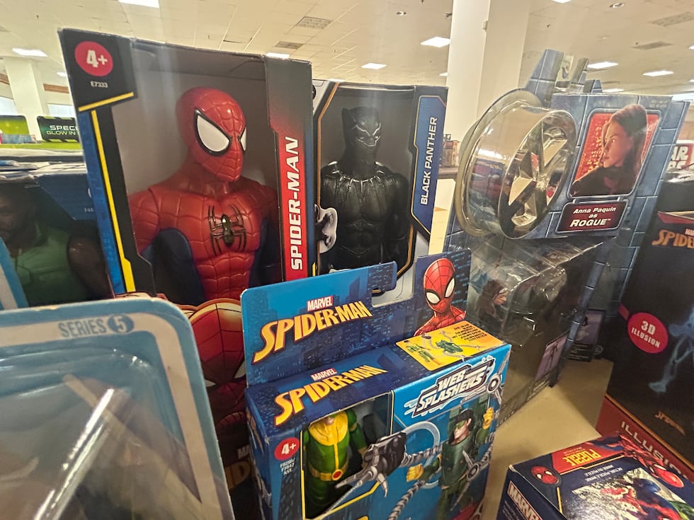 Donated toys like these action figures are starting to fill tables at the Christmas Connection...