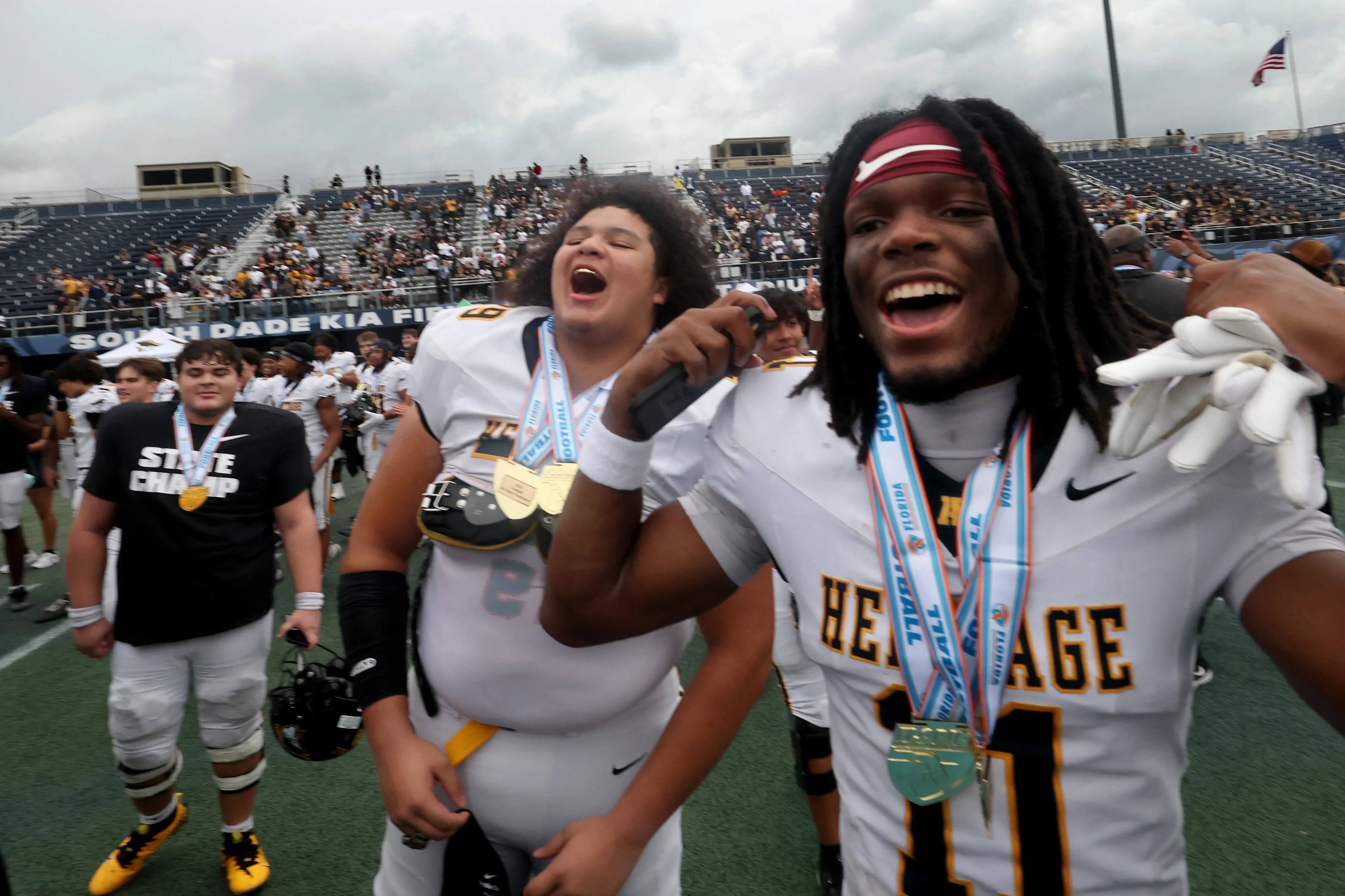 American Heritage High Schoolâs Brandon Bennett along with his teammates...
