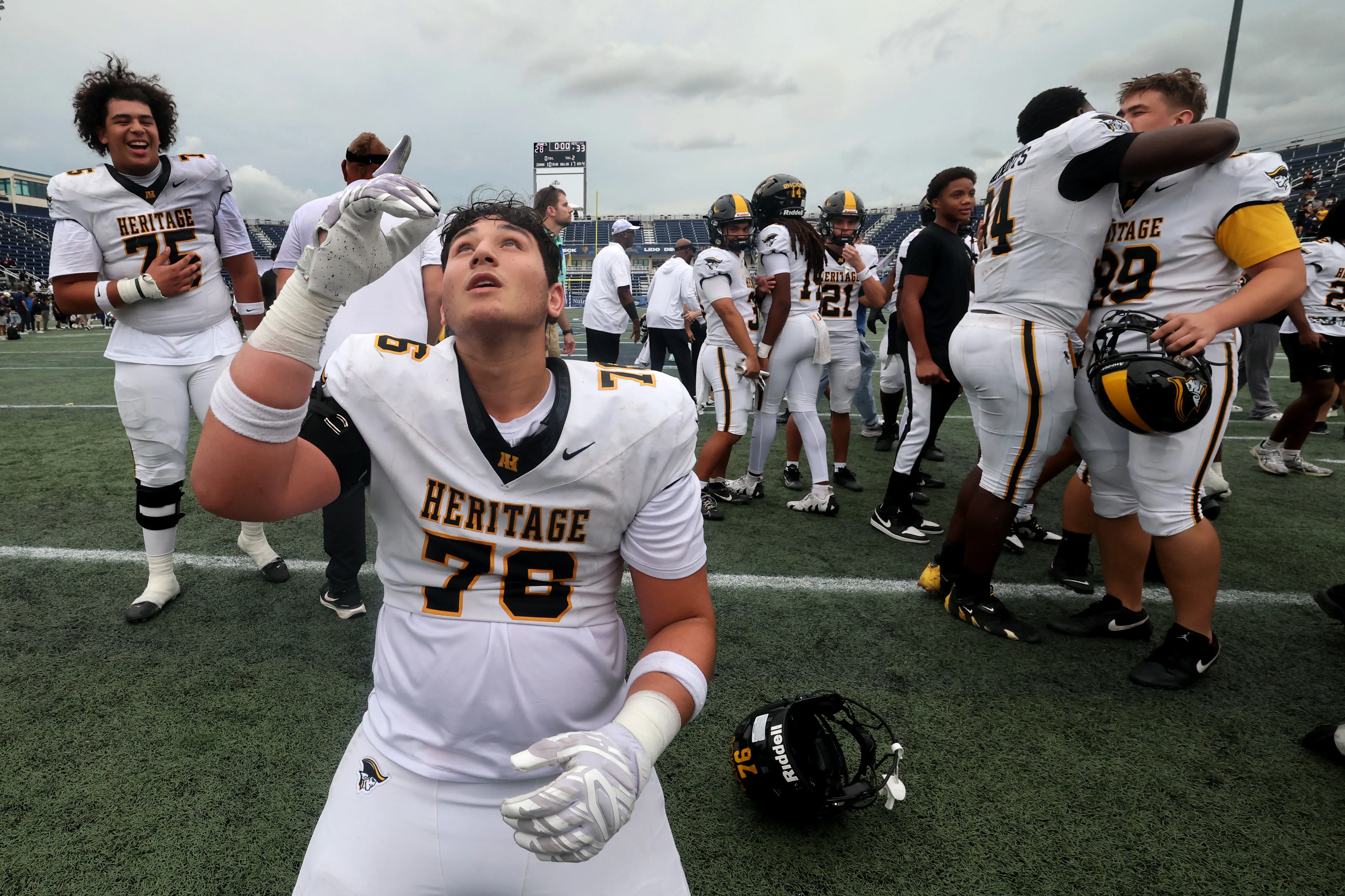 American Heritage High Schoolâs players celebrate their win against Jones...