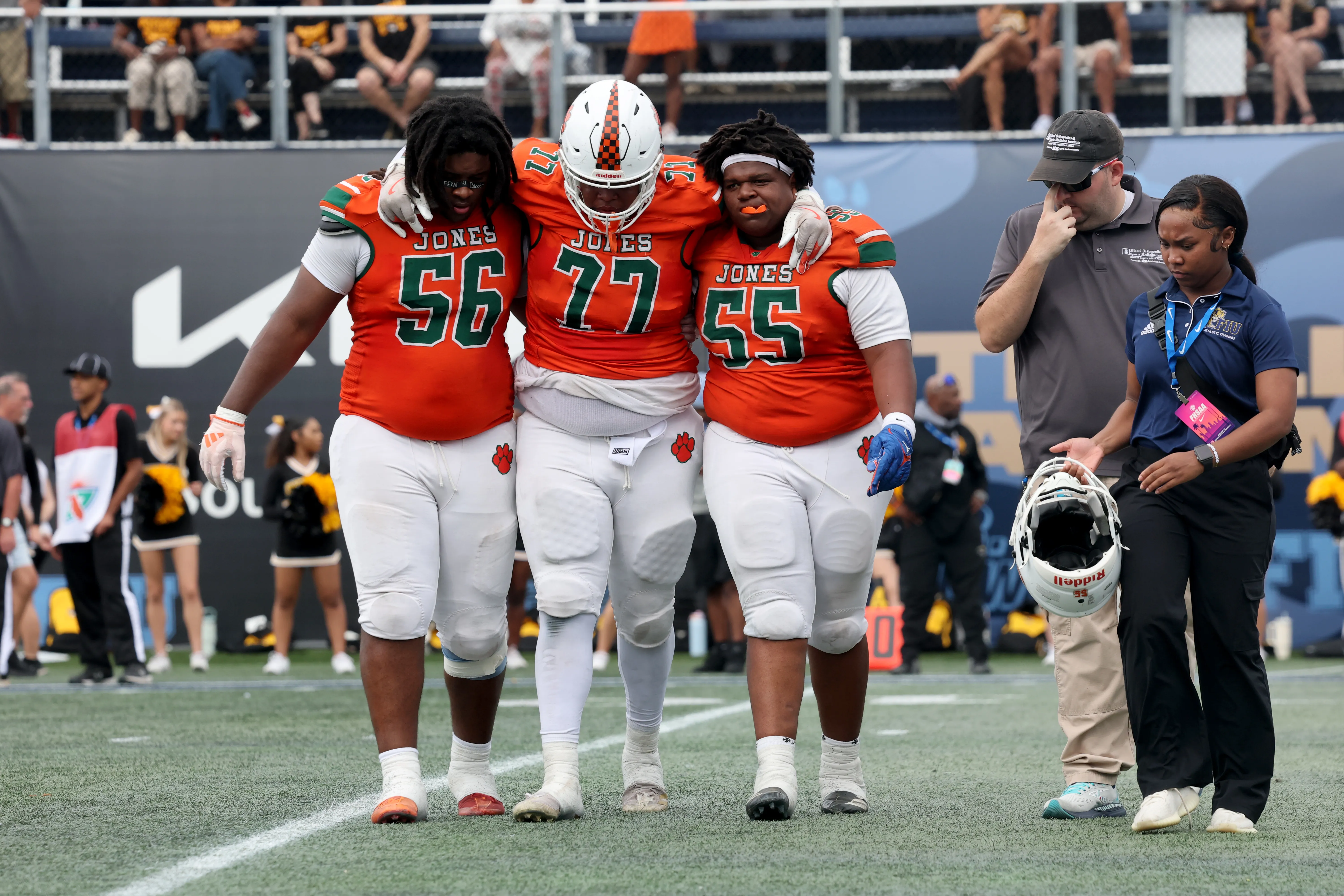 Jones High School players Daincan Success and Corey Brown help...