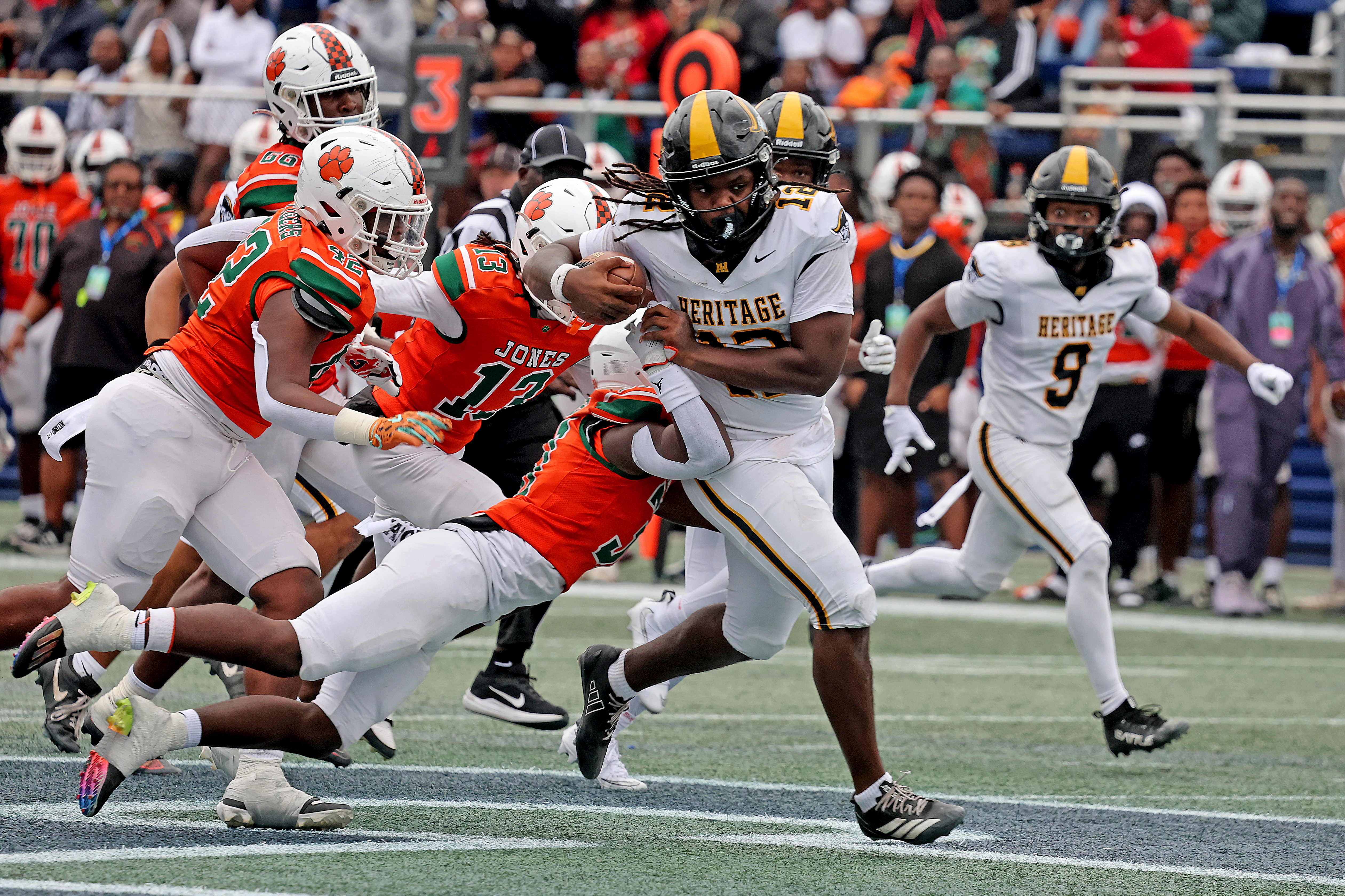 American Heritage High Schoolâs Leon Strawder runs the ball against...