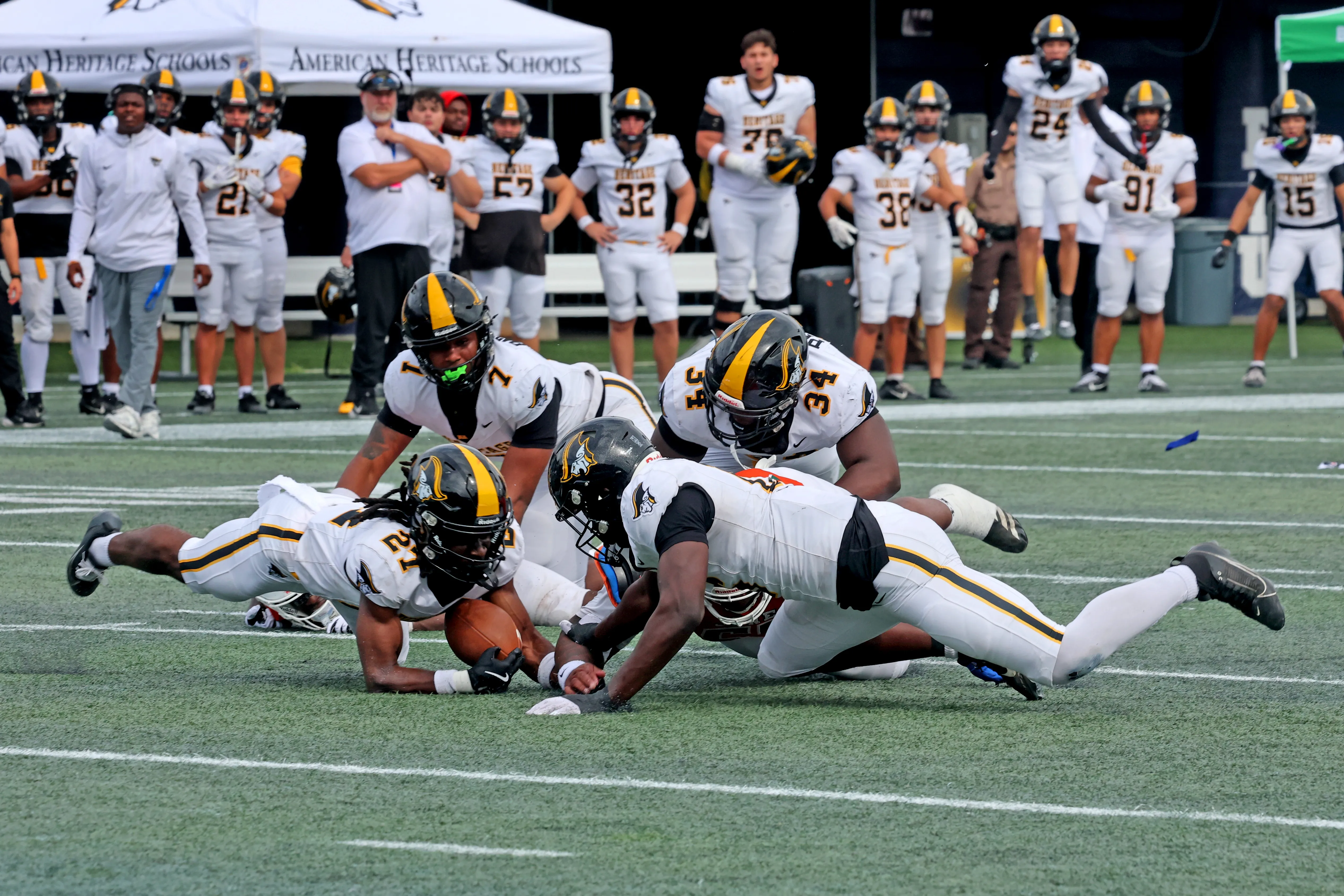 American Heritage High Schoolâs defense recovers a fumble against Jones...