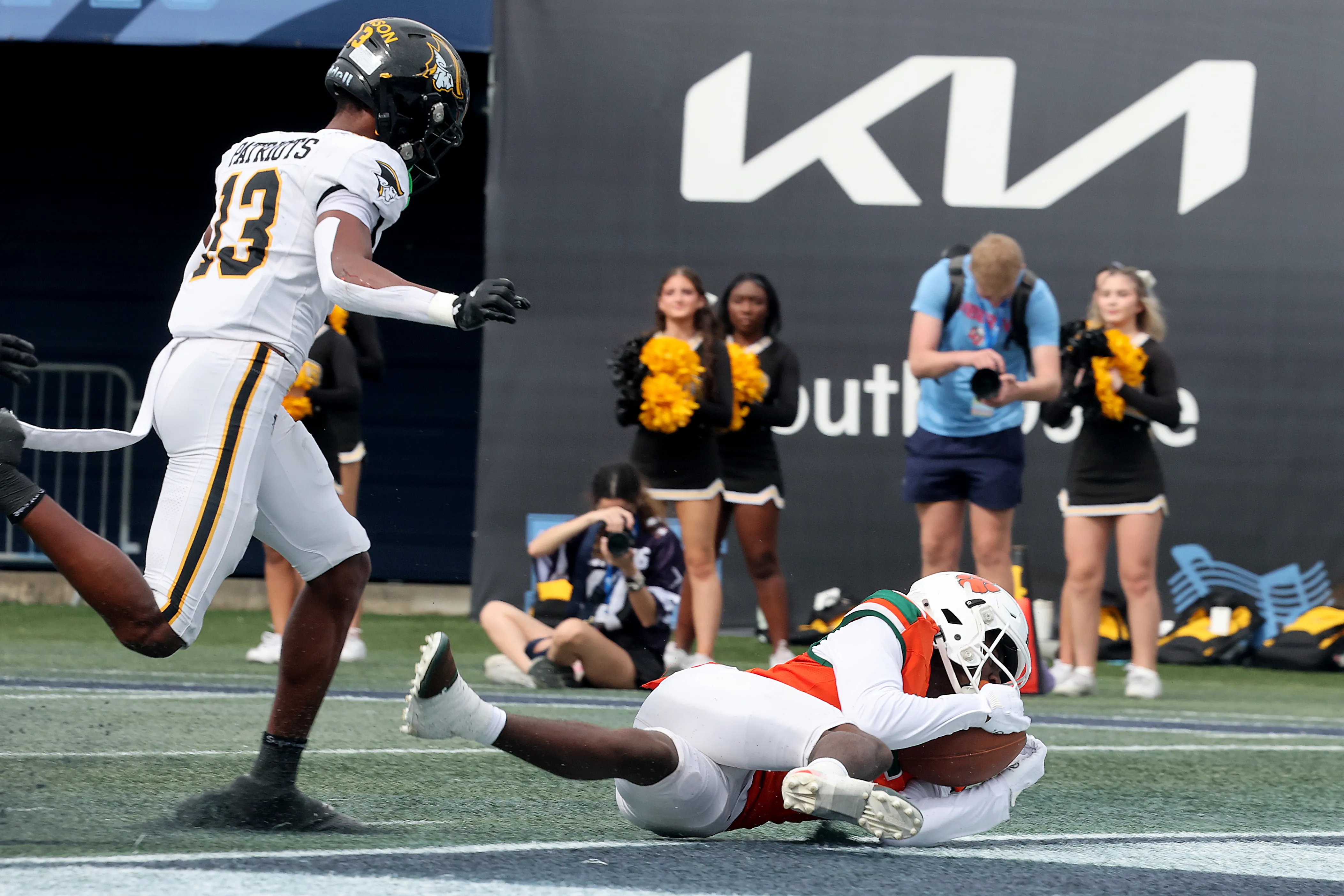 Jones High Schoolâs Daionte Hicks scores the first touchdown of...