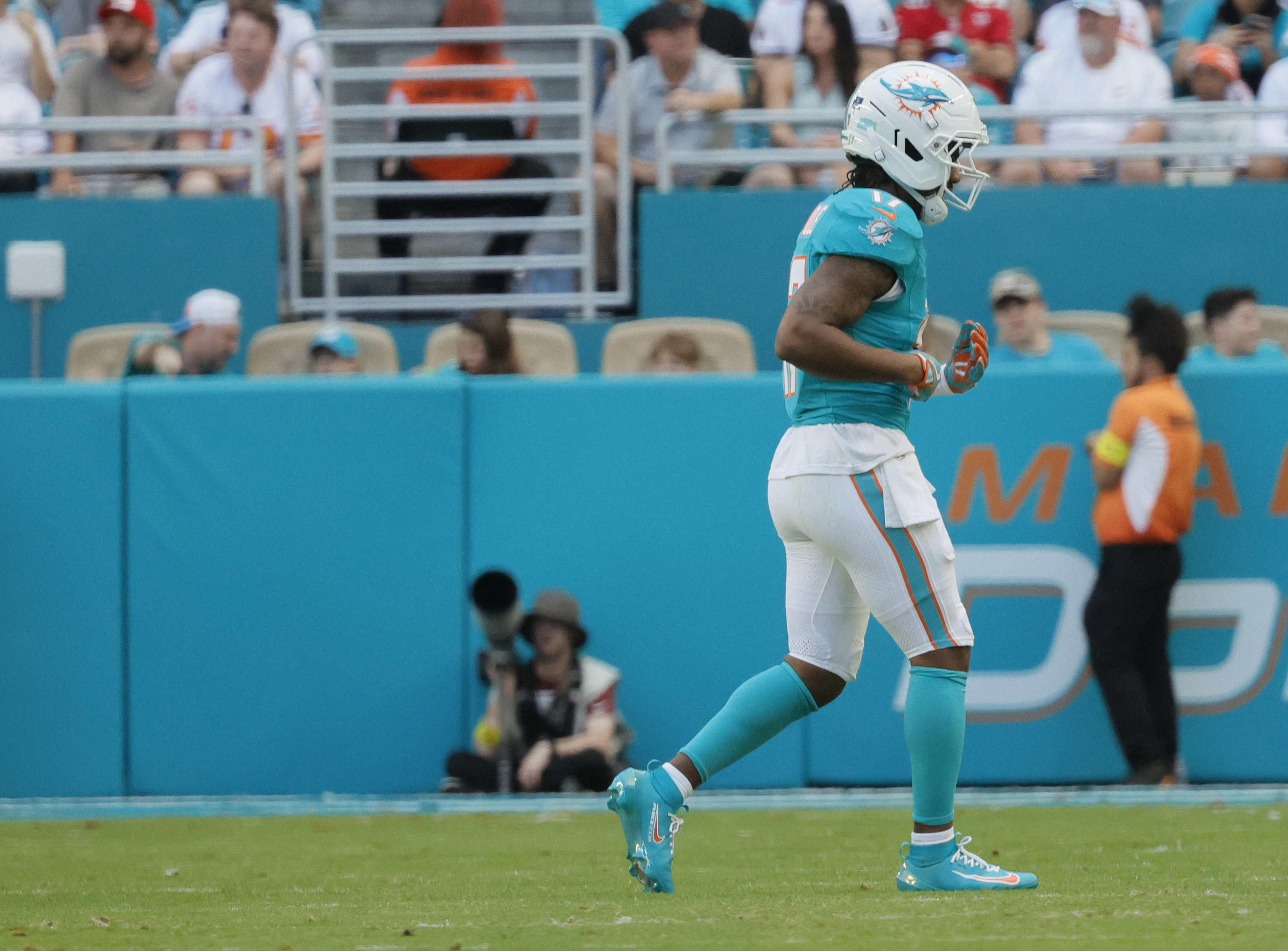 Miami Dolphins wide receiver Jaylen Waddle (17) walks off the...