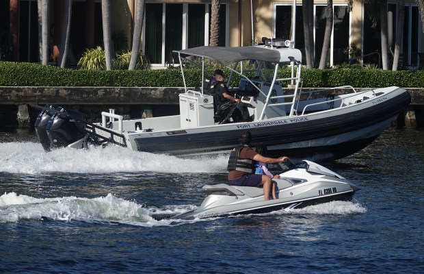 Marine officers with the Fort Lauderdale Police Department patrol the Intracoastal Waterway near Hugh Taylor Birch State Park on Tuesday. (Joe Cavaretta/South Florida Sun Sentinel)