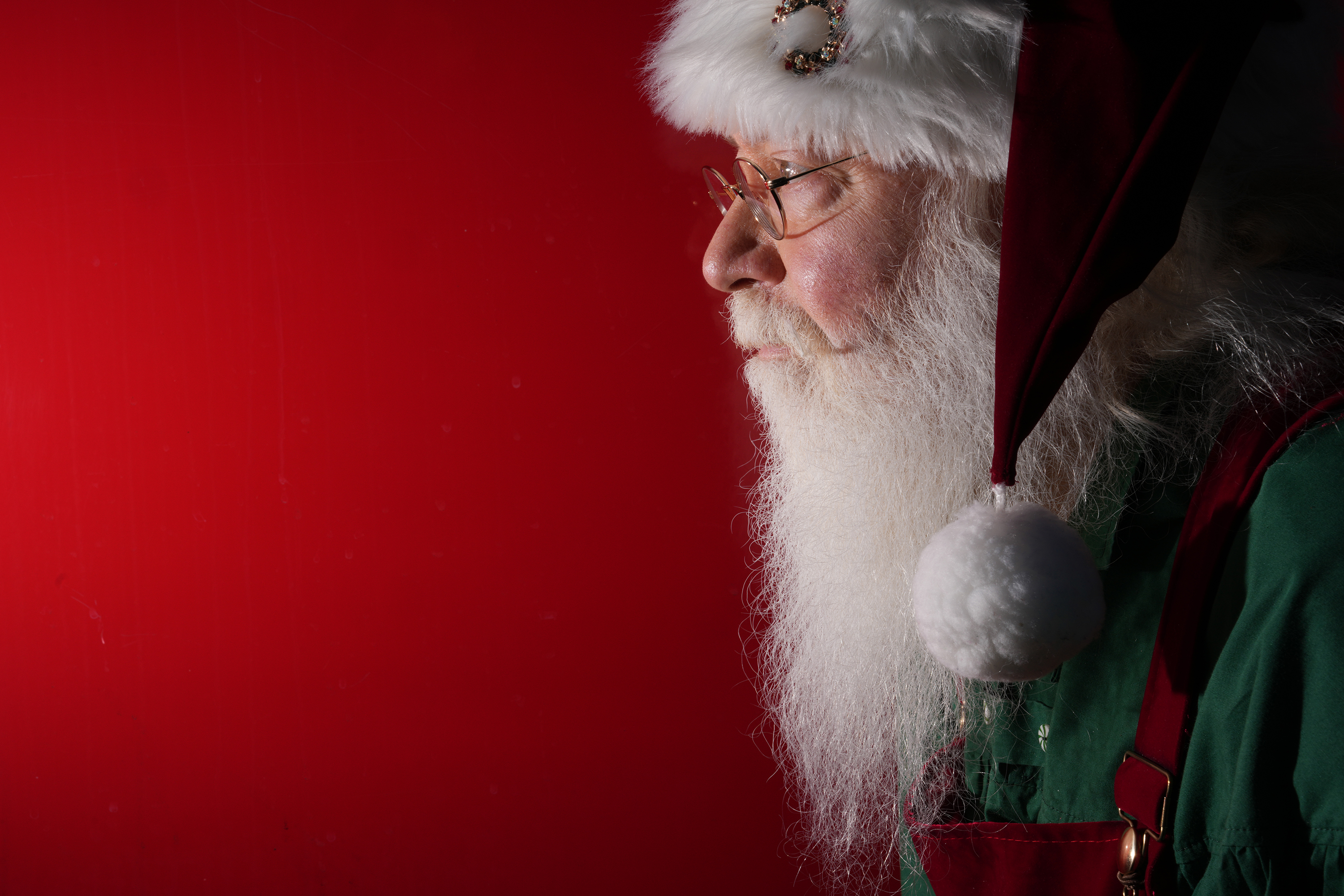 Richard Adler of West Palm Beach plays Santa during a...