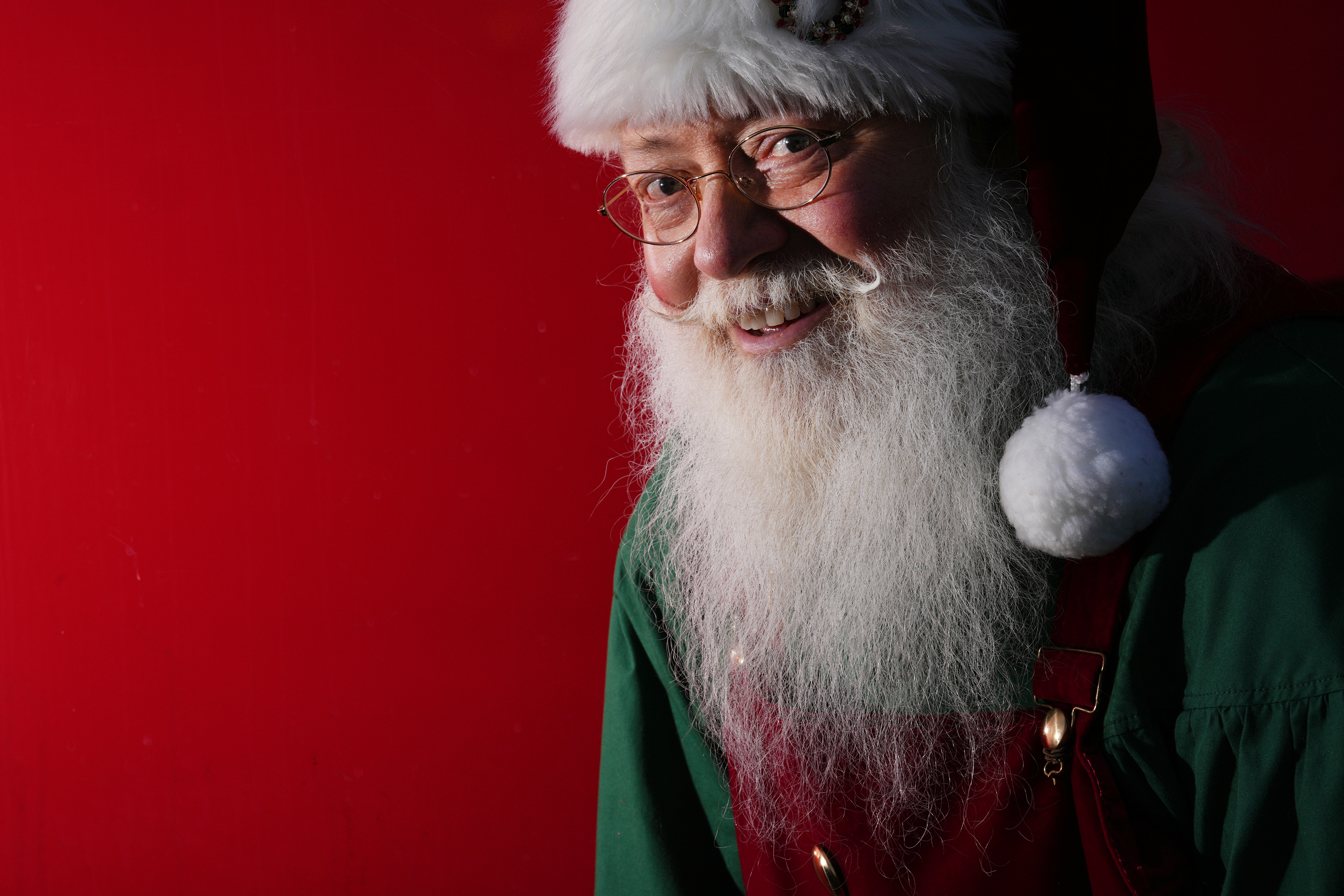 Richard Adler of West Palm Beach plays Santa during a...