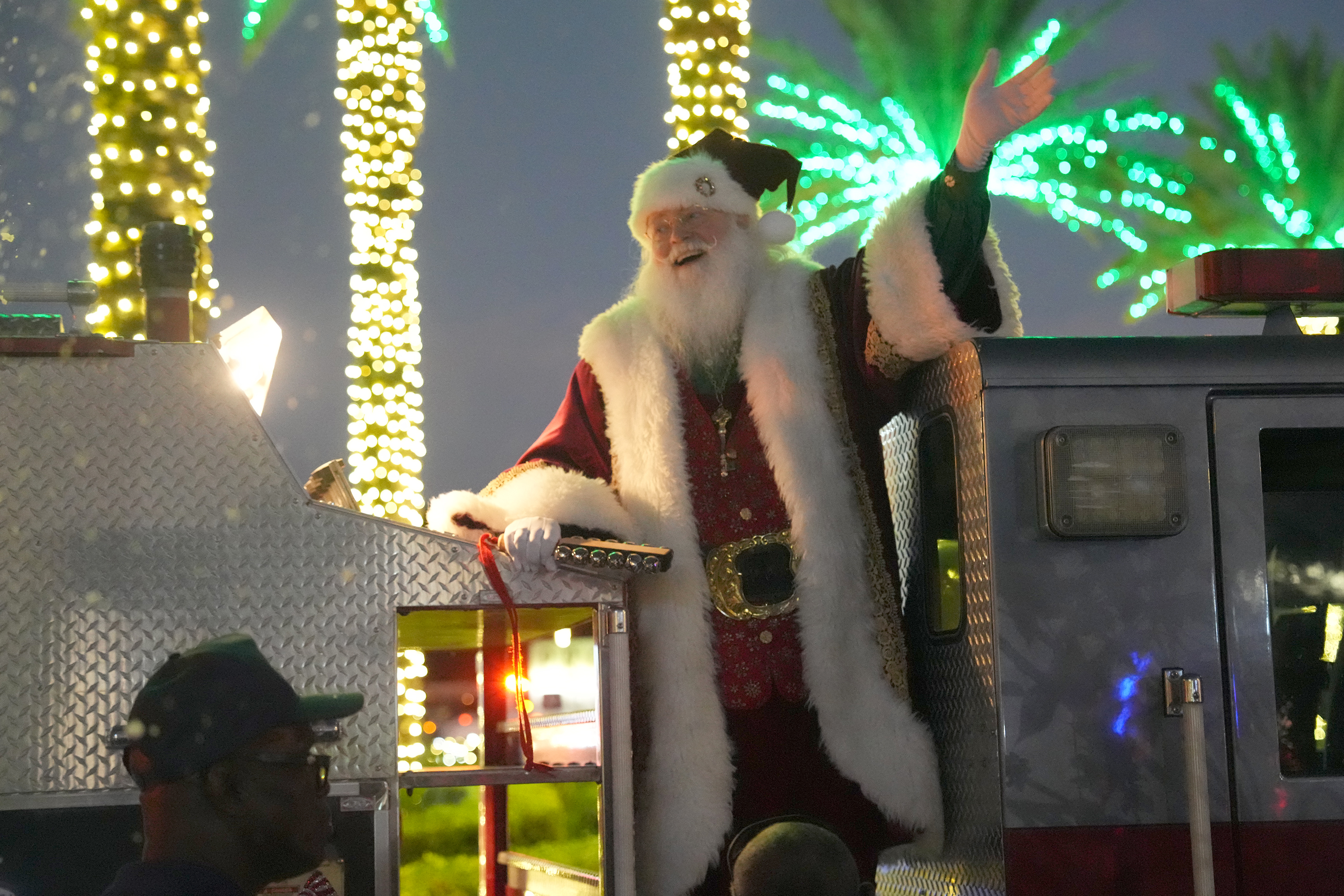 Richard Adler of West Palm Beach plays Santa during a...