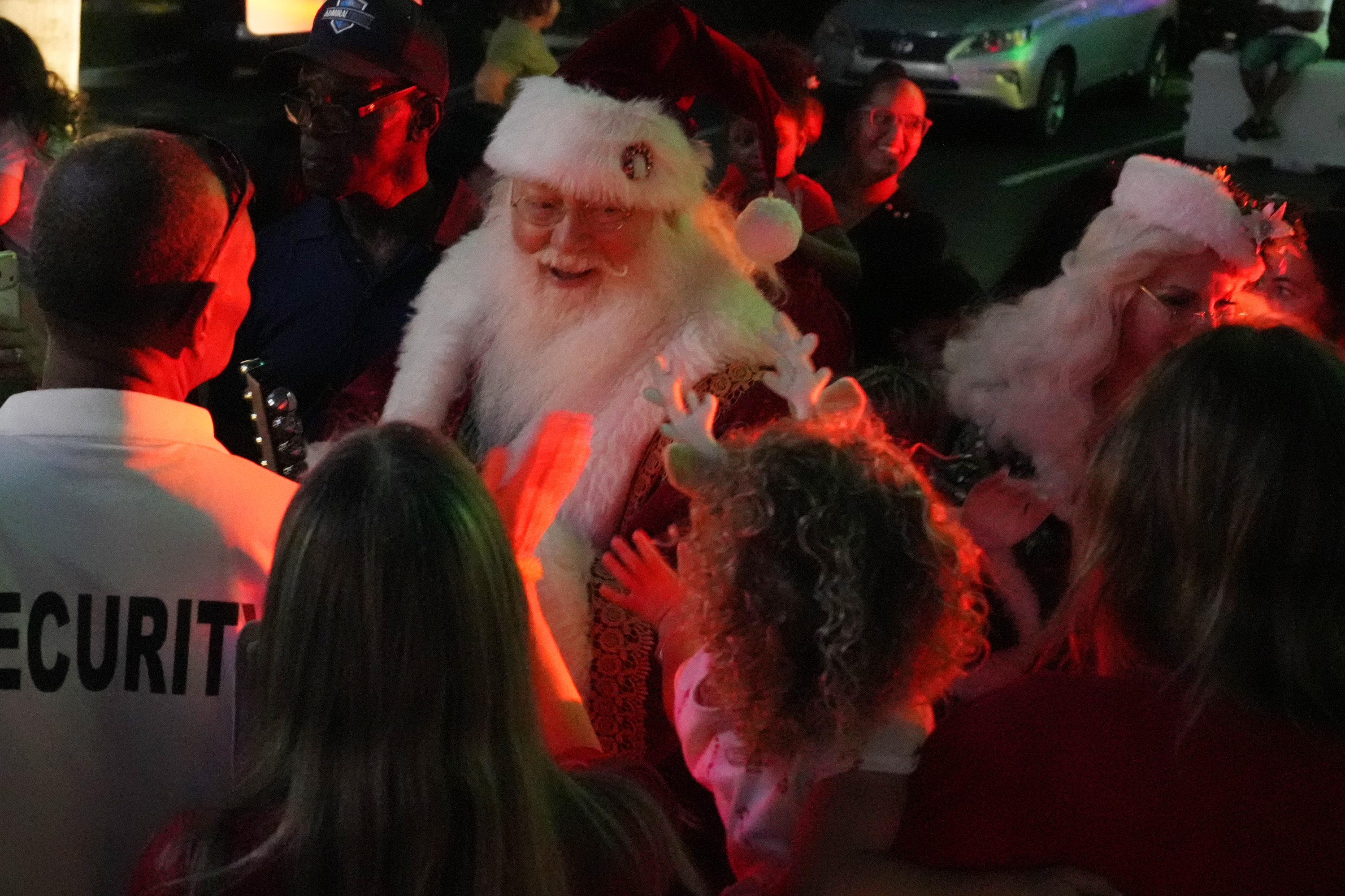 Richard Adler of West Palm Beach plays Santa during a...