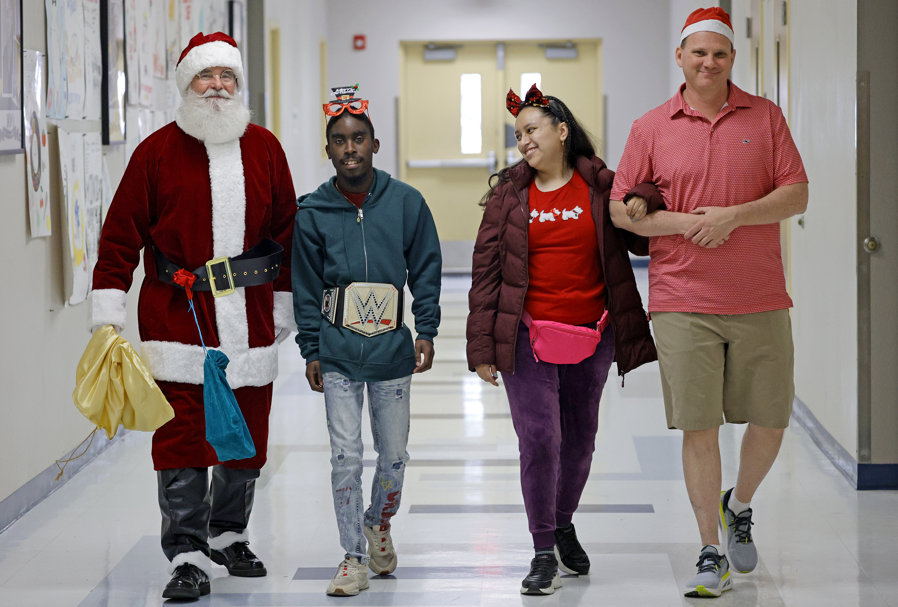 Sun Sentinel staff writer Ben Crandell, dressed as Santa Claus,...