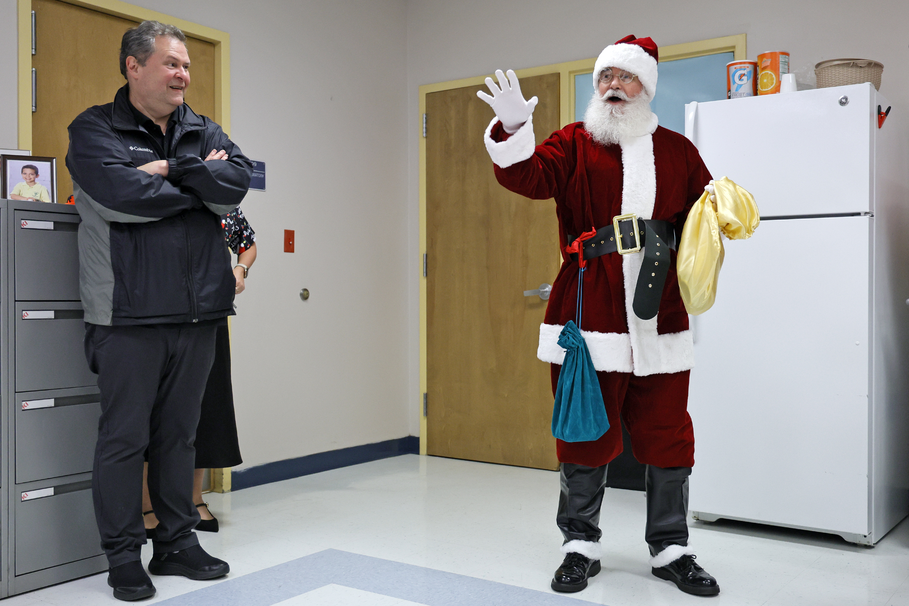 Sun Sentinel staff writer Ben Crandell, dressed as Santa Claus,...