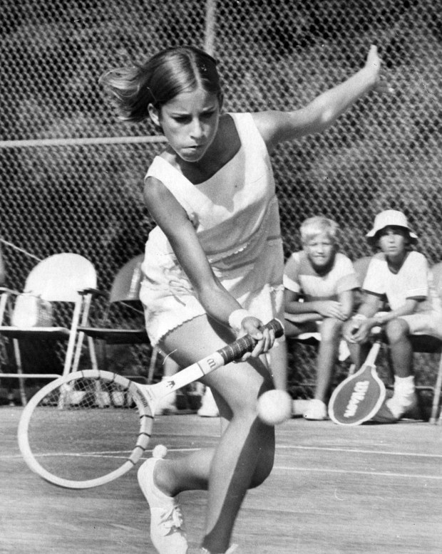 Chris Evert hitting a ball on the court while other kids wait their turn. Date: July 9 1970 Staff Photo/ Mel KenyonEarly years at Holiday Park. Summer before high school.