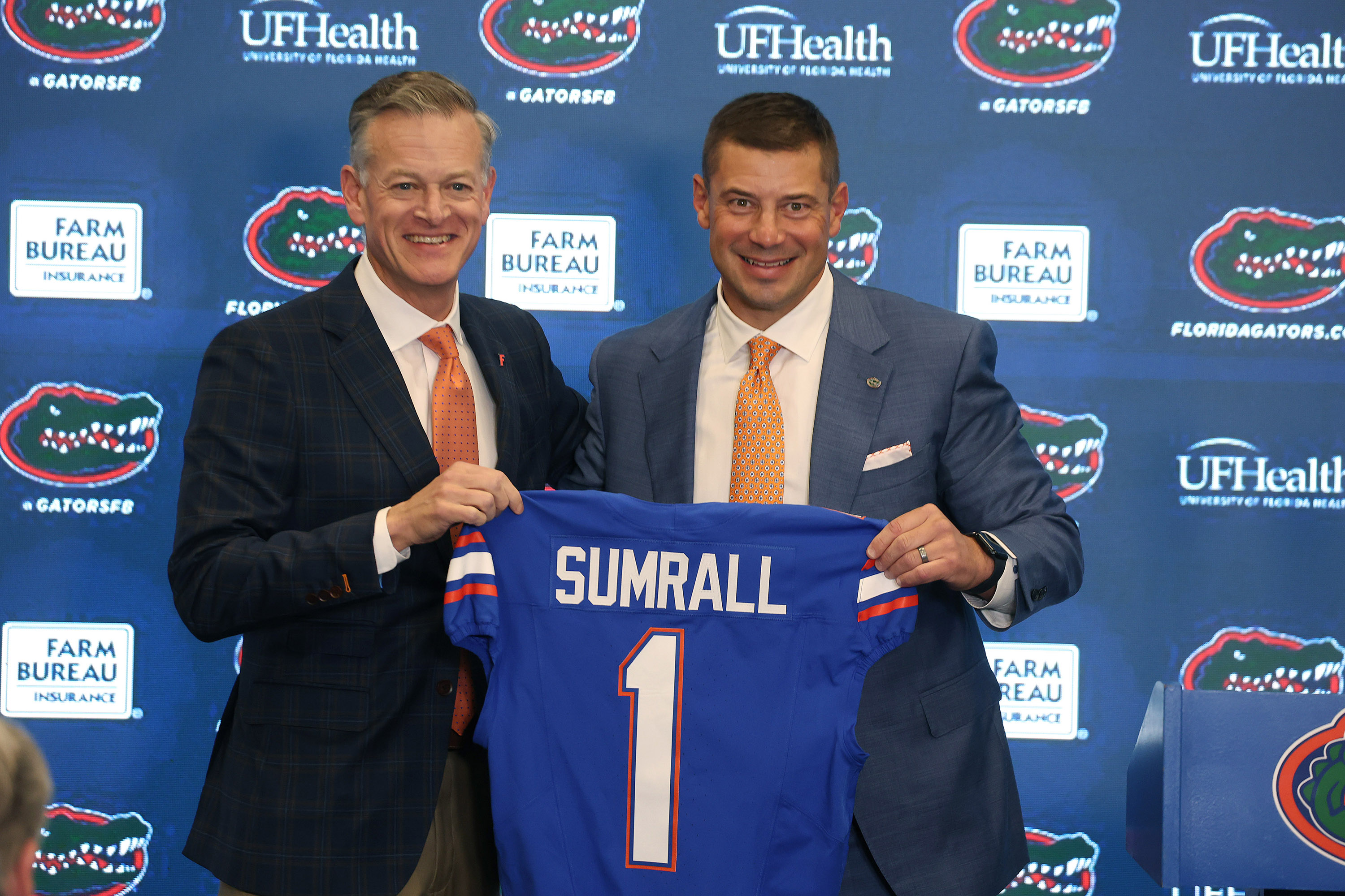 New Florida football coach Jon Sumrall (right) is 17-9 away from home during two-year stints at each Tulane and Troy. Billy Napier's teams were 5-18 during his four seasons. (Stephen M. Dowell/Orlando Sentinel)