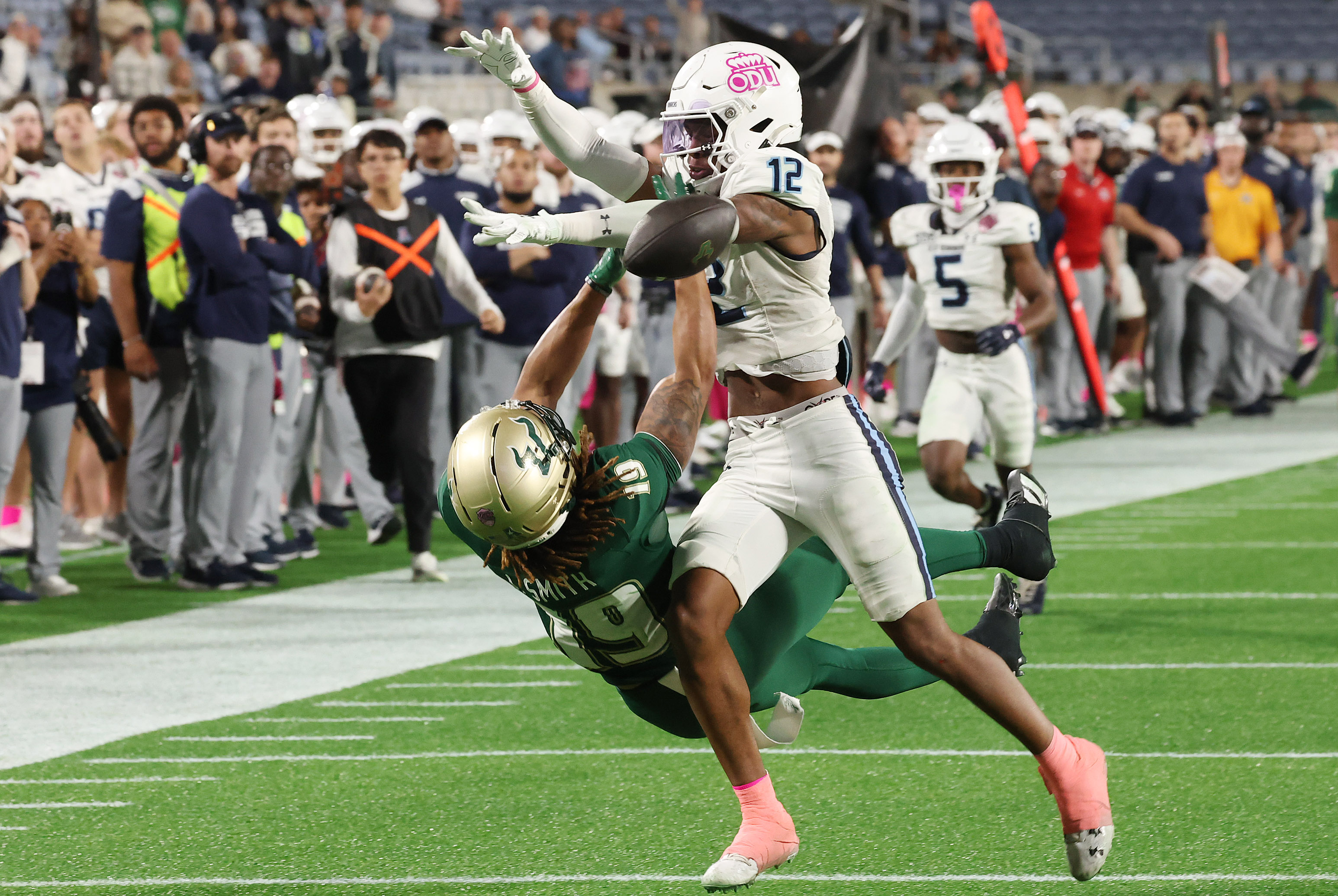 Old Dominion safety Jerome Carter (12) knocks away a pass...