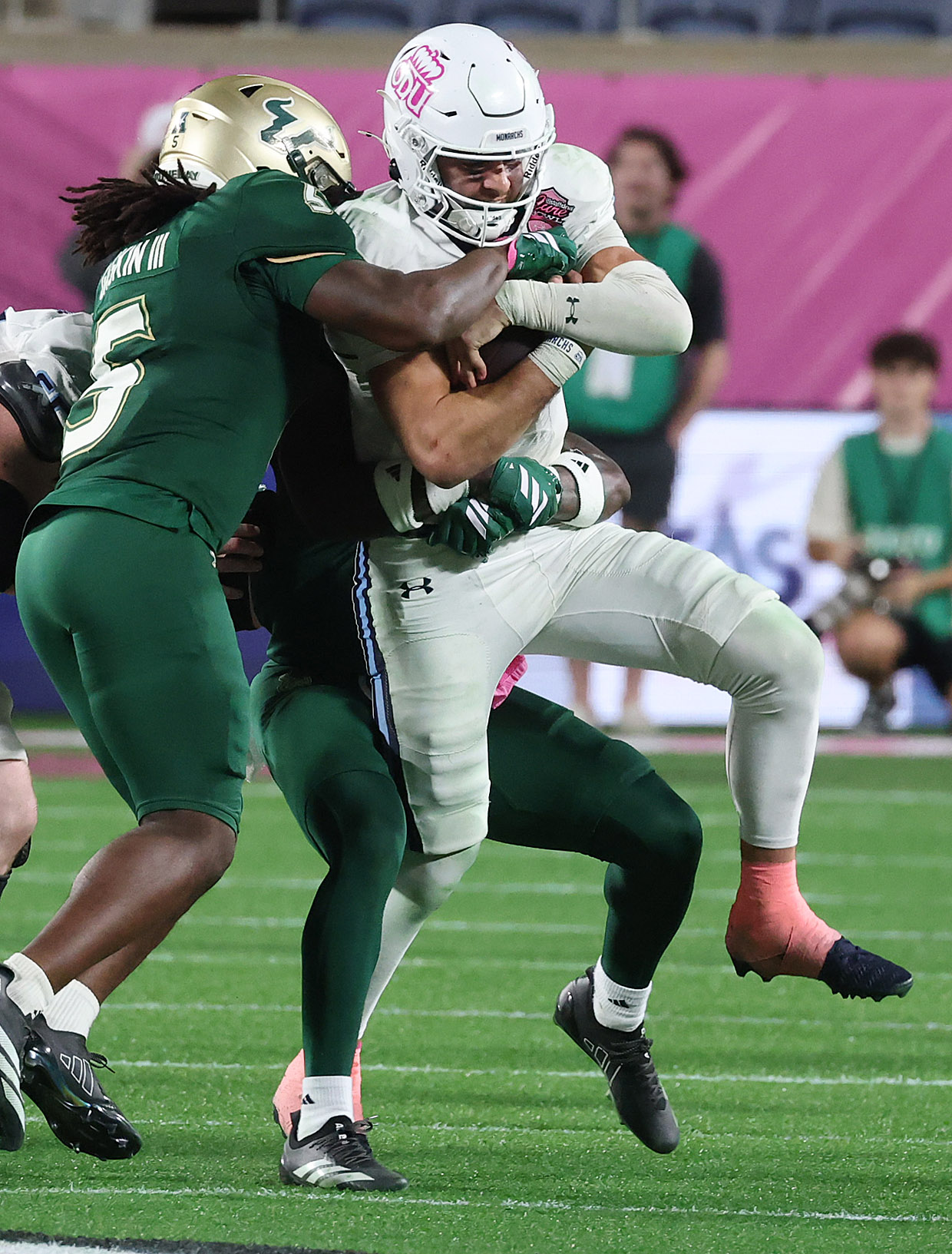 Old Dominion quarterback Quinn Henicle (10) drives through the tackle...
