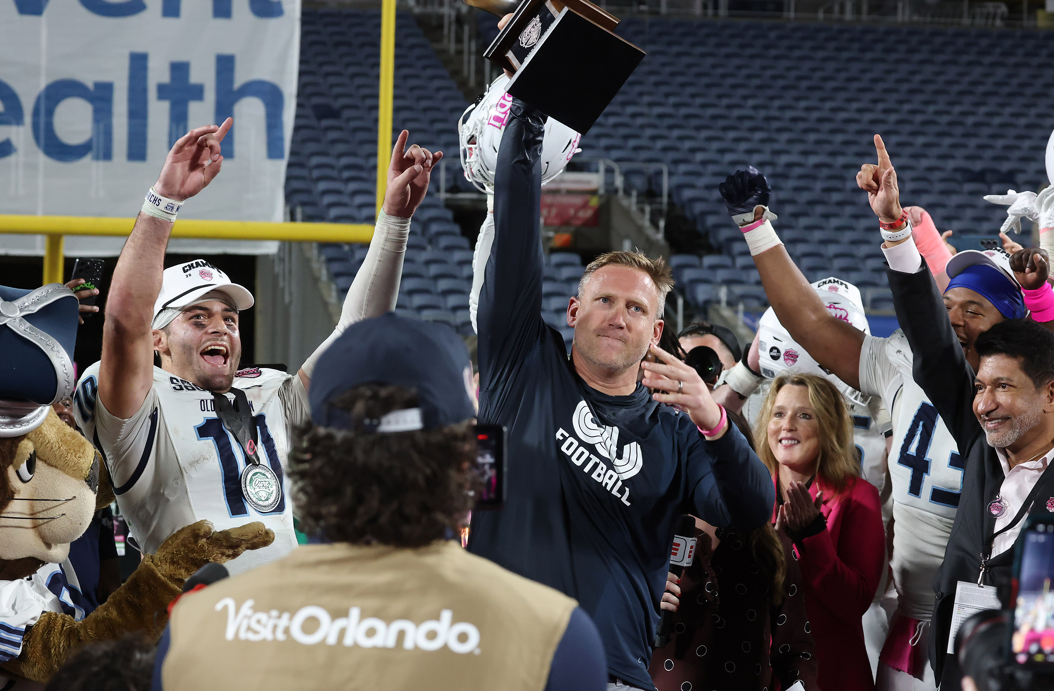 Old Dominion quarterback Quinn Henicle (10) and head coach Ricky...
