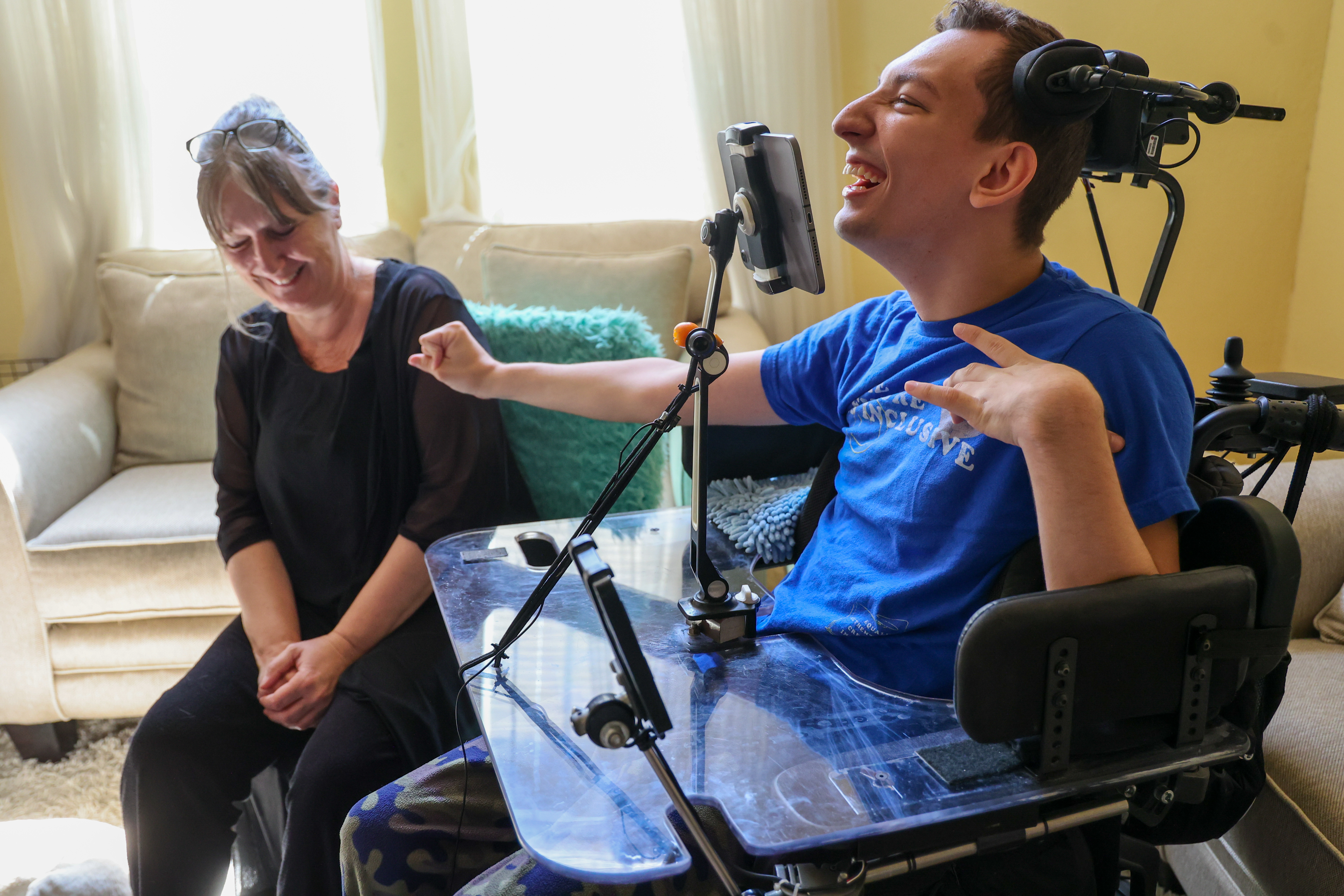 JJ Holmes and his mom, Alison Holmes, share a laugh...