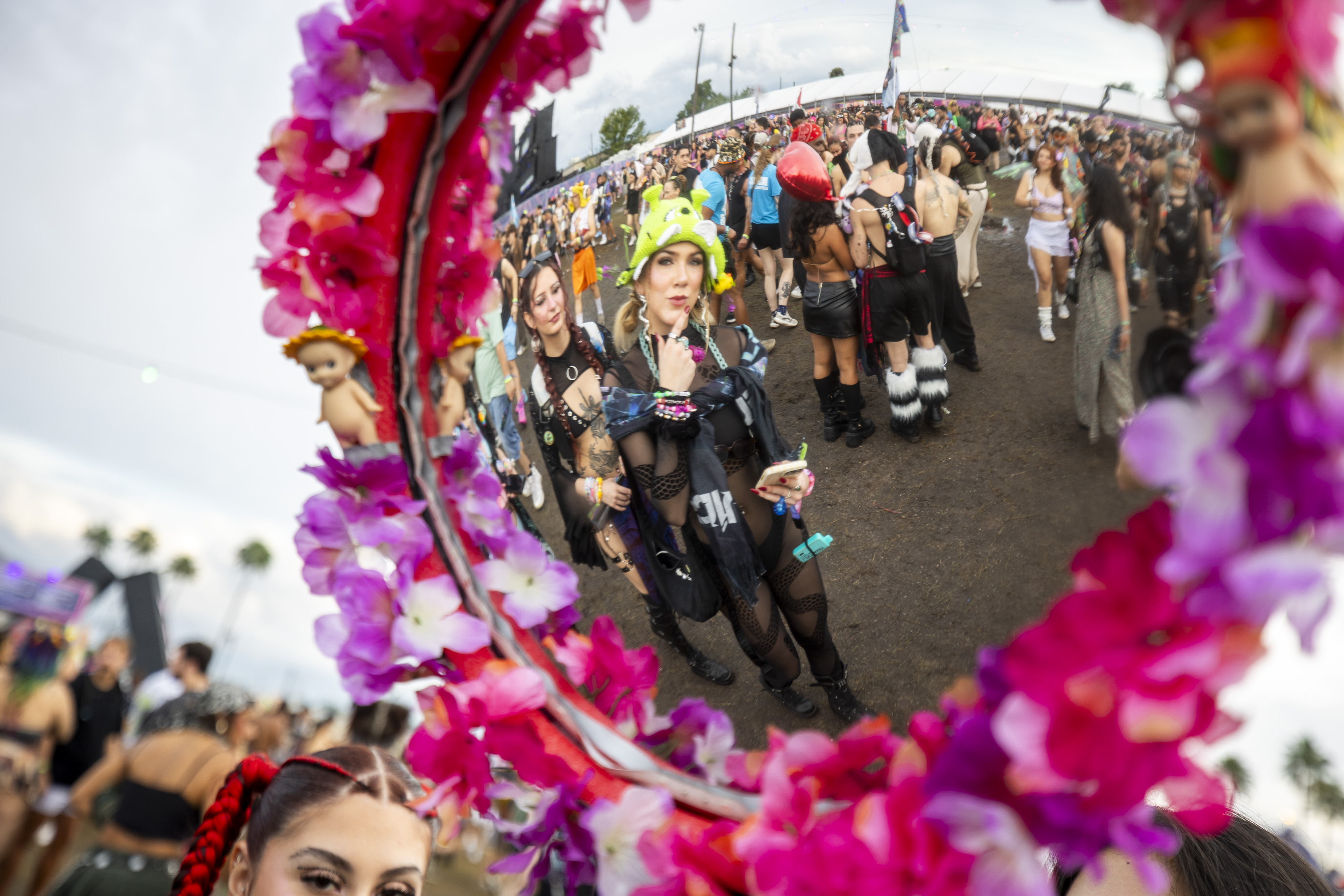 Festival-goers make their way into EDC Orlando, as seen in...