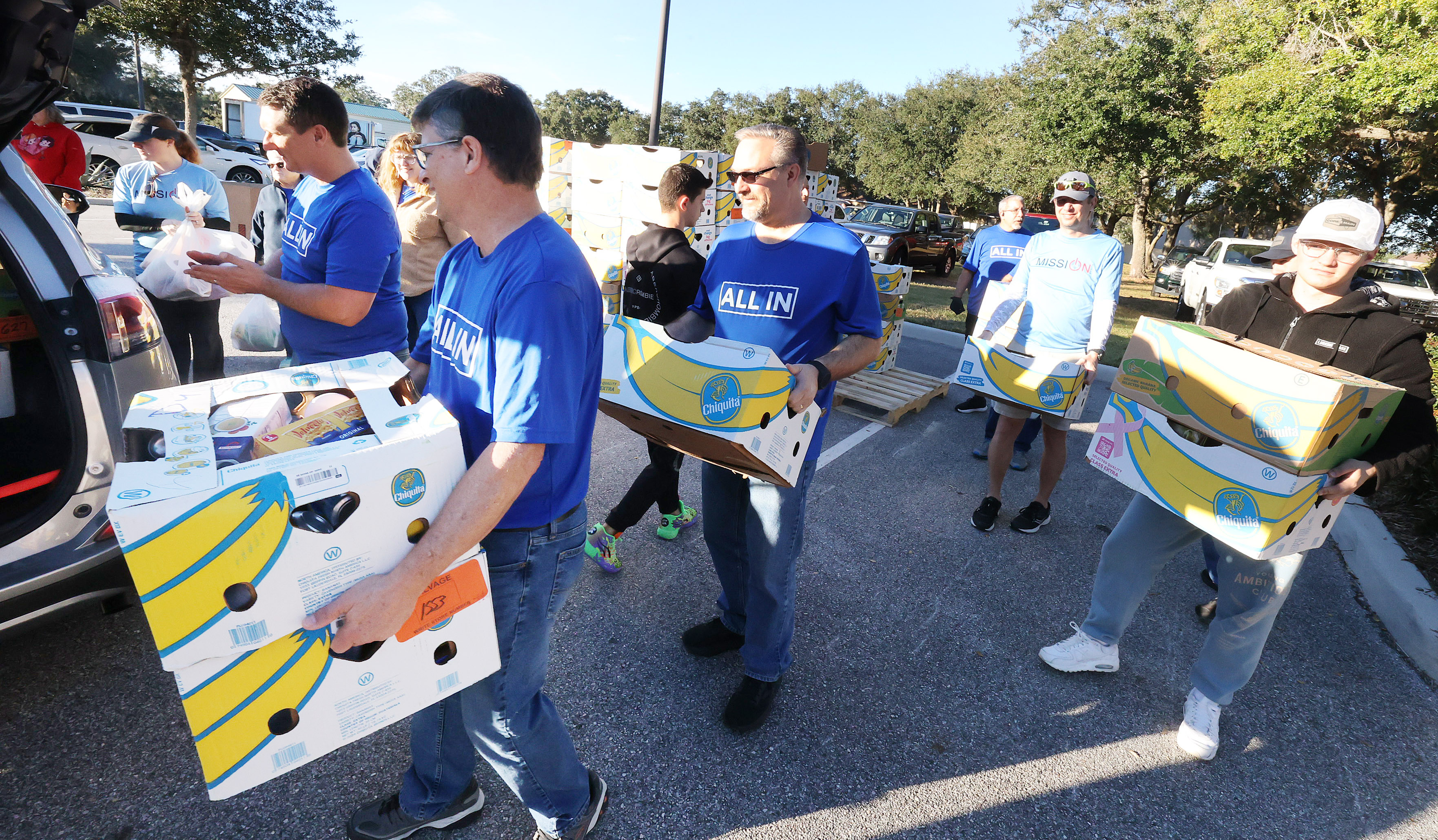Boxes of food and home good items are loaded into...