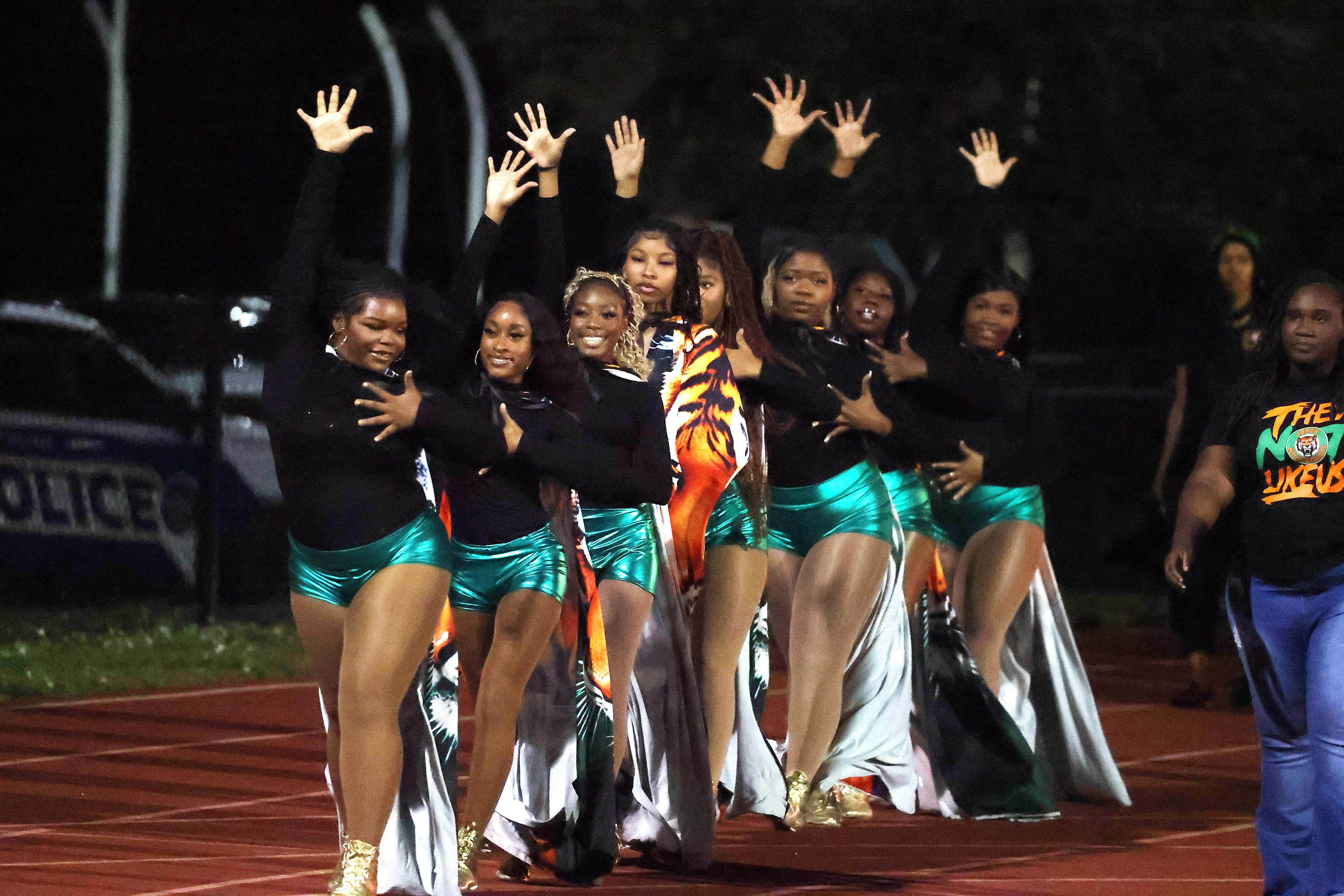 The Jones High band marches on to the field during...