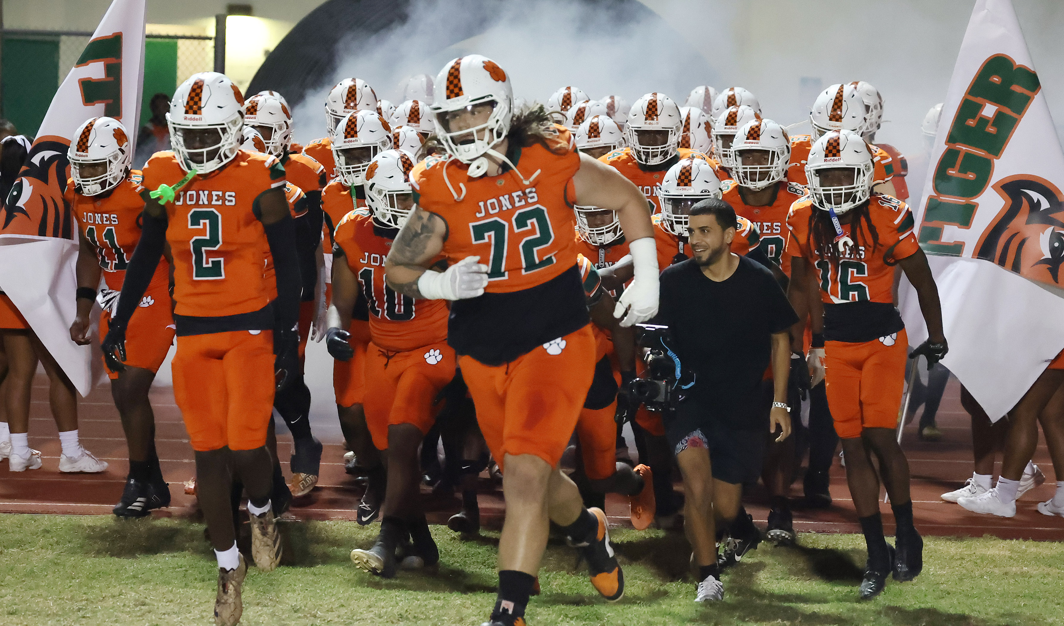 Jones players run onto the field for the Port Charlotte...