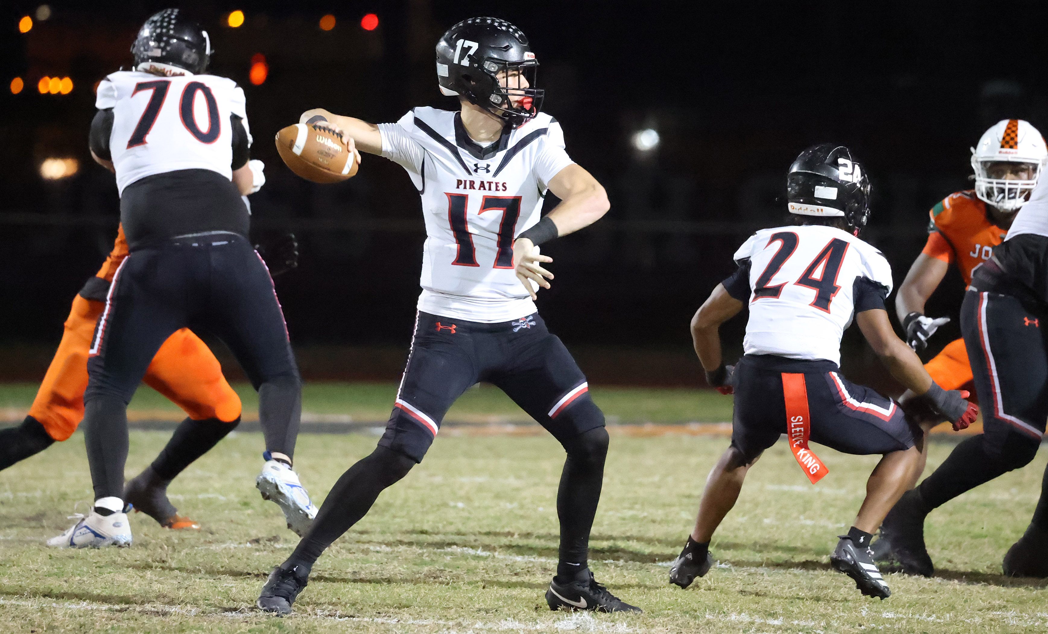 Port Charlotte quarterback Logan Flaherty throws during the Port Charlotte...