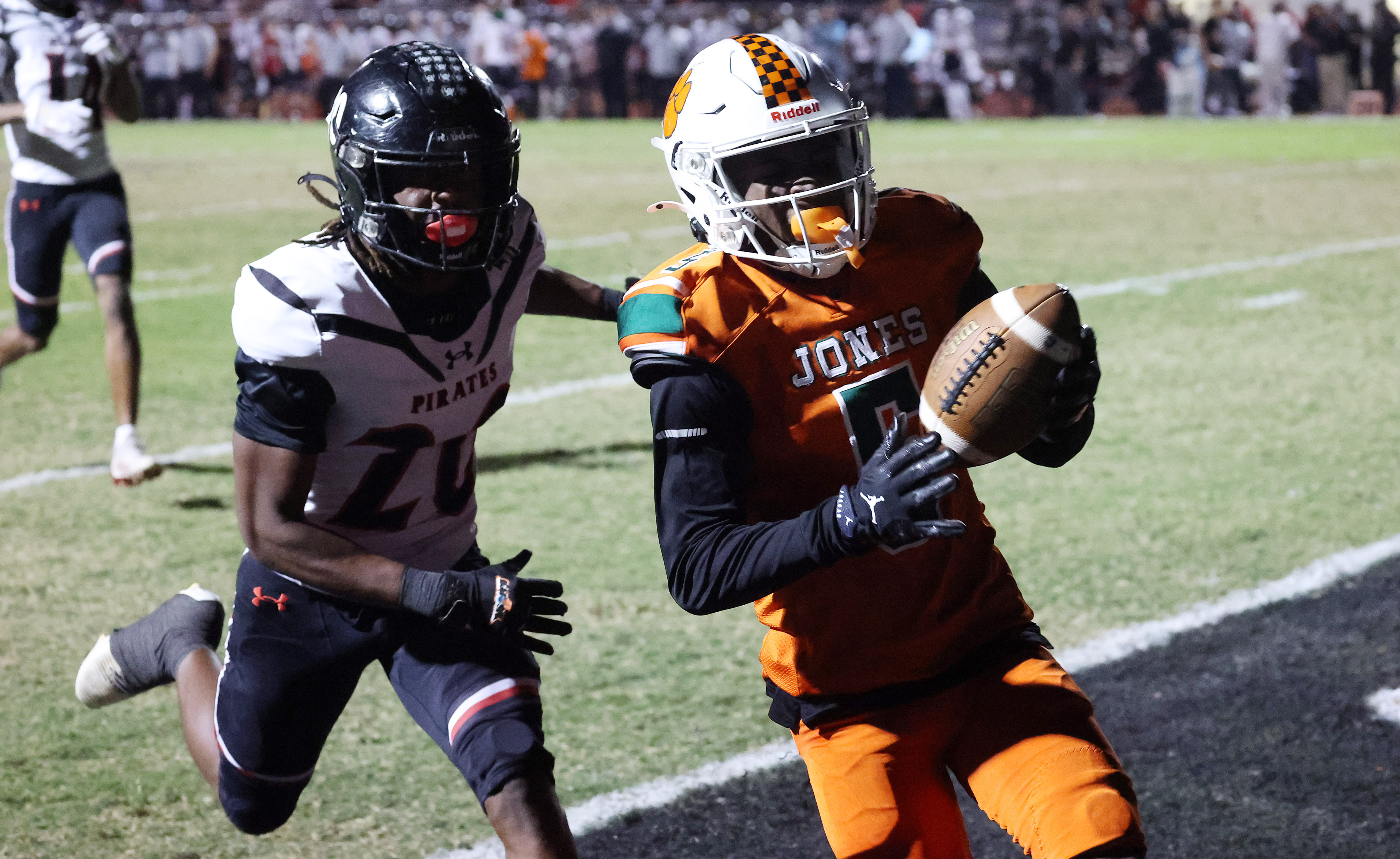 Jones High receiver DJ Hicks (5) runs into the endzone...