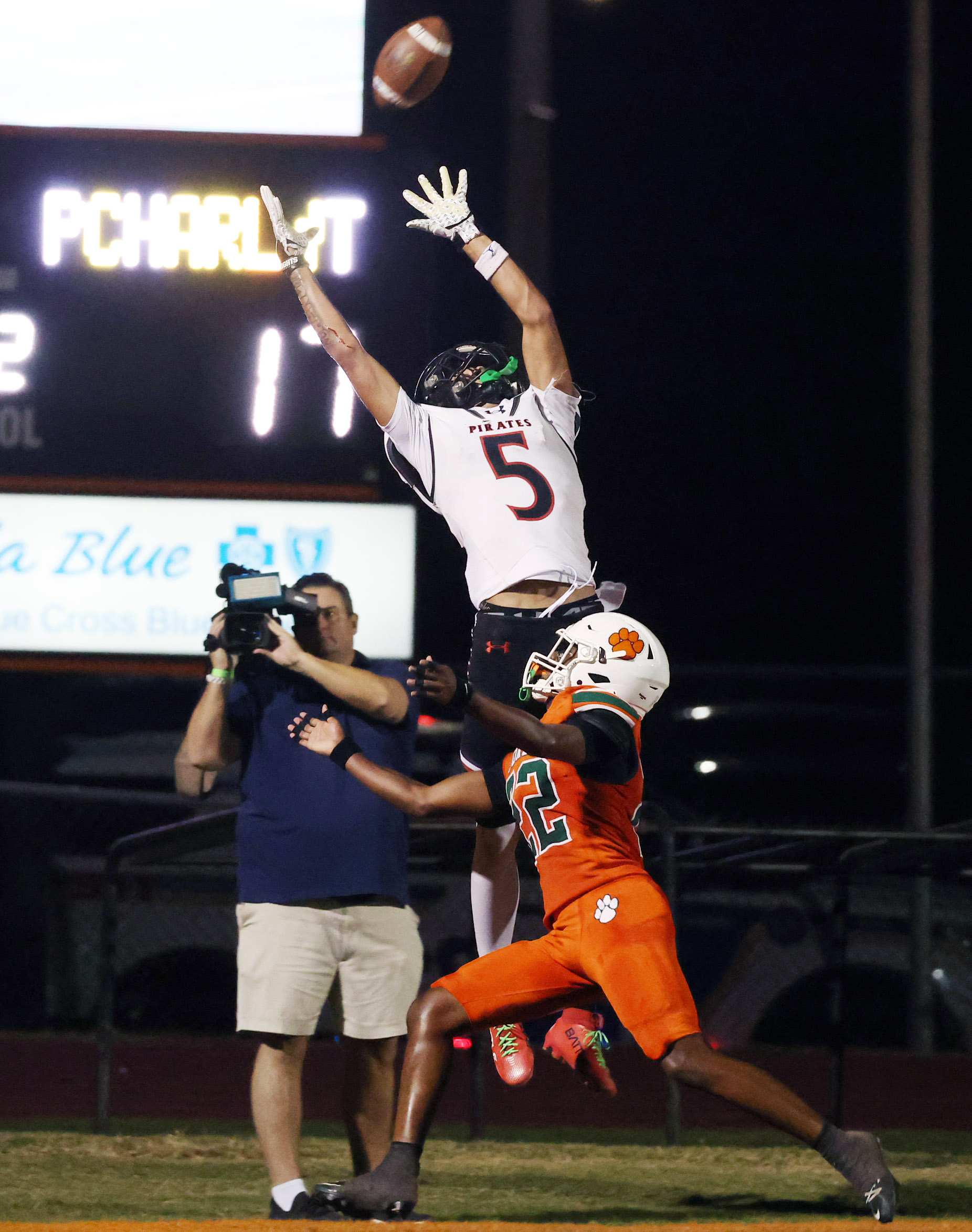 Port Charlotte receiver Dallas Lambert (5) leaps for a pass...