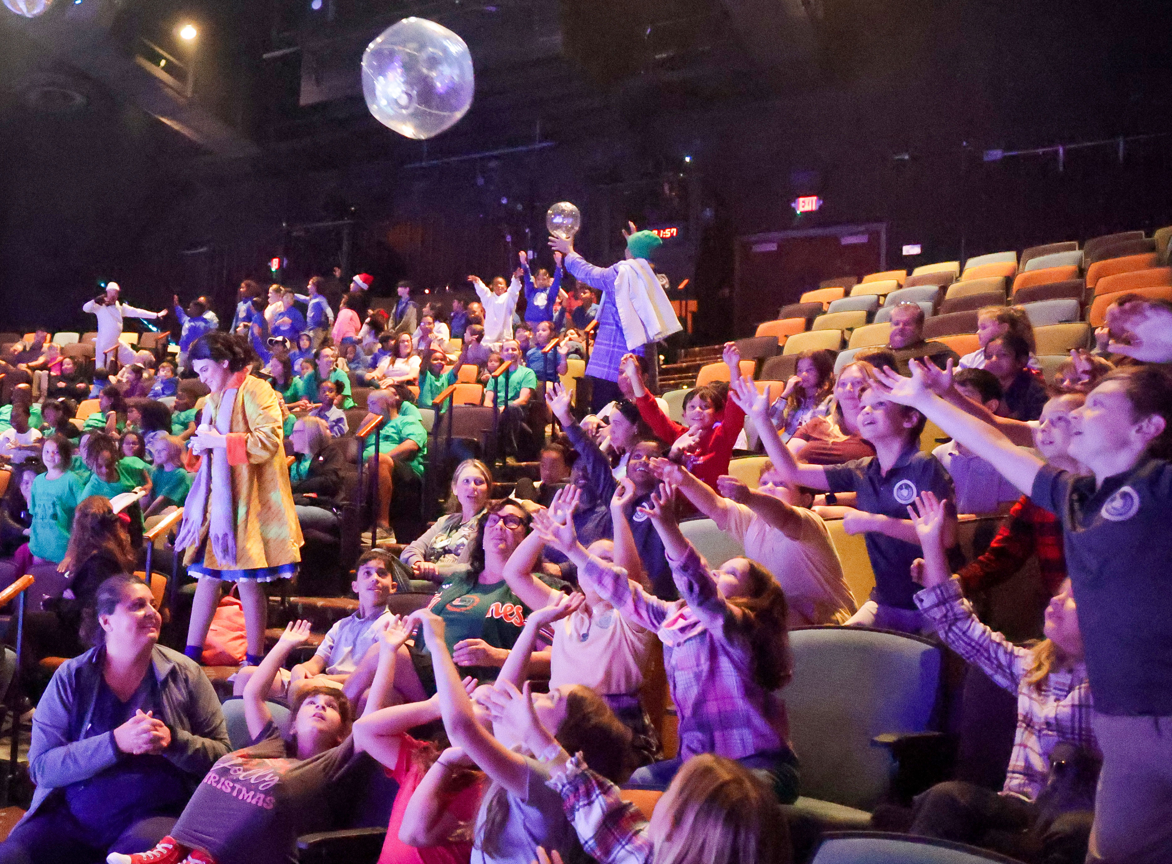 Students react as âsnowballsâ bounce into the audience during a...