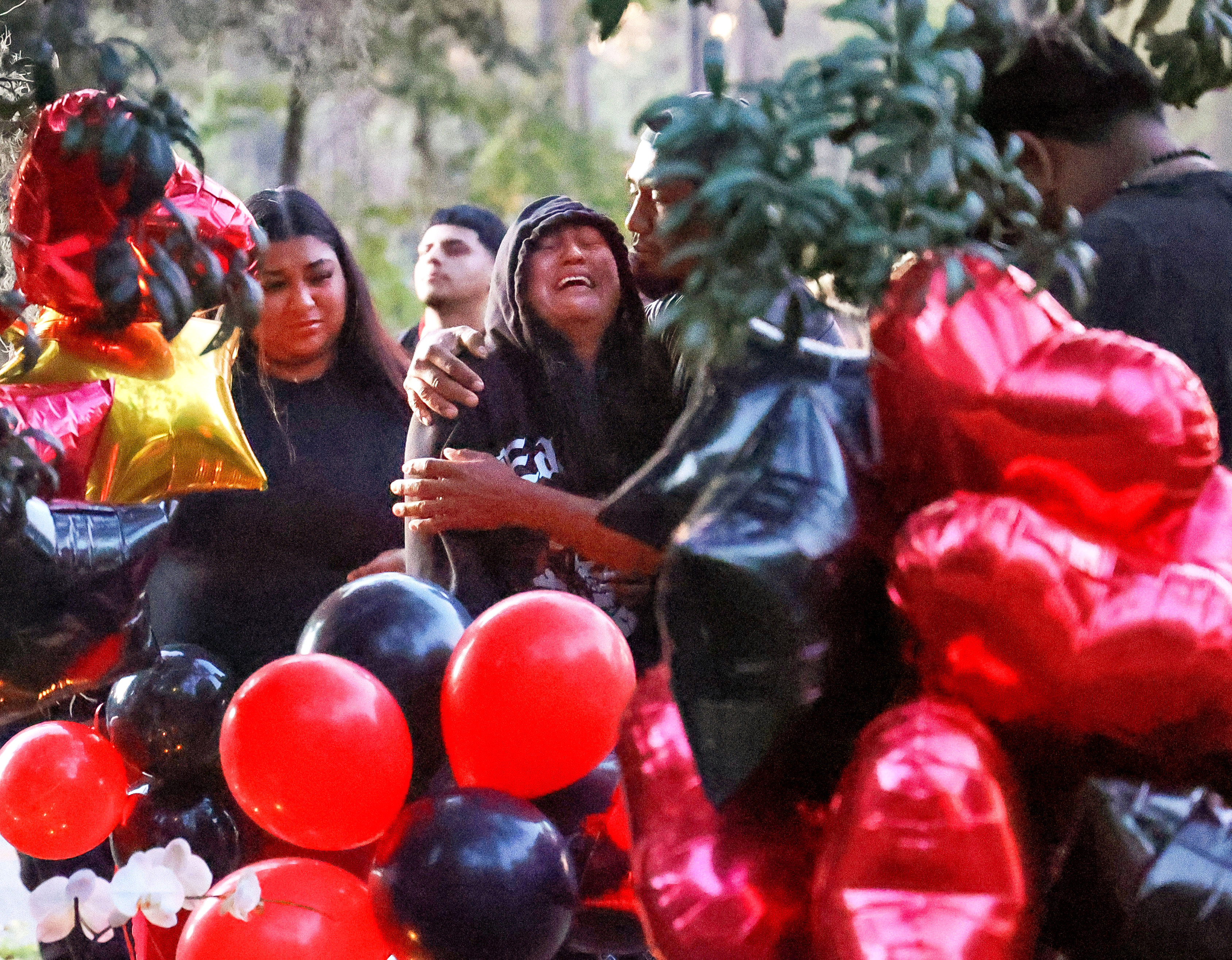 Johanna Lopez, the mother of Julio Lopez, grieves during a...