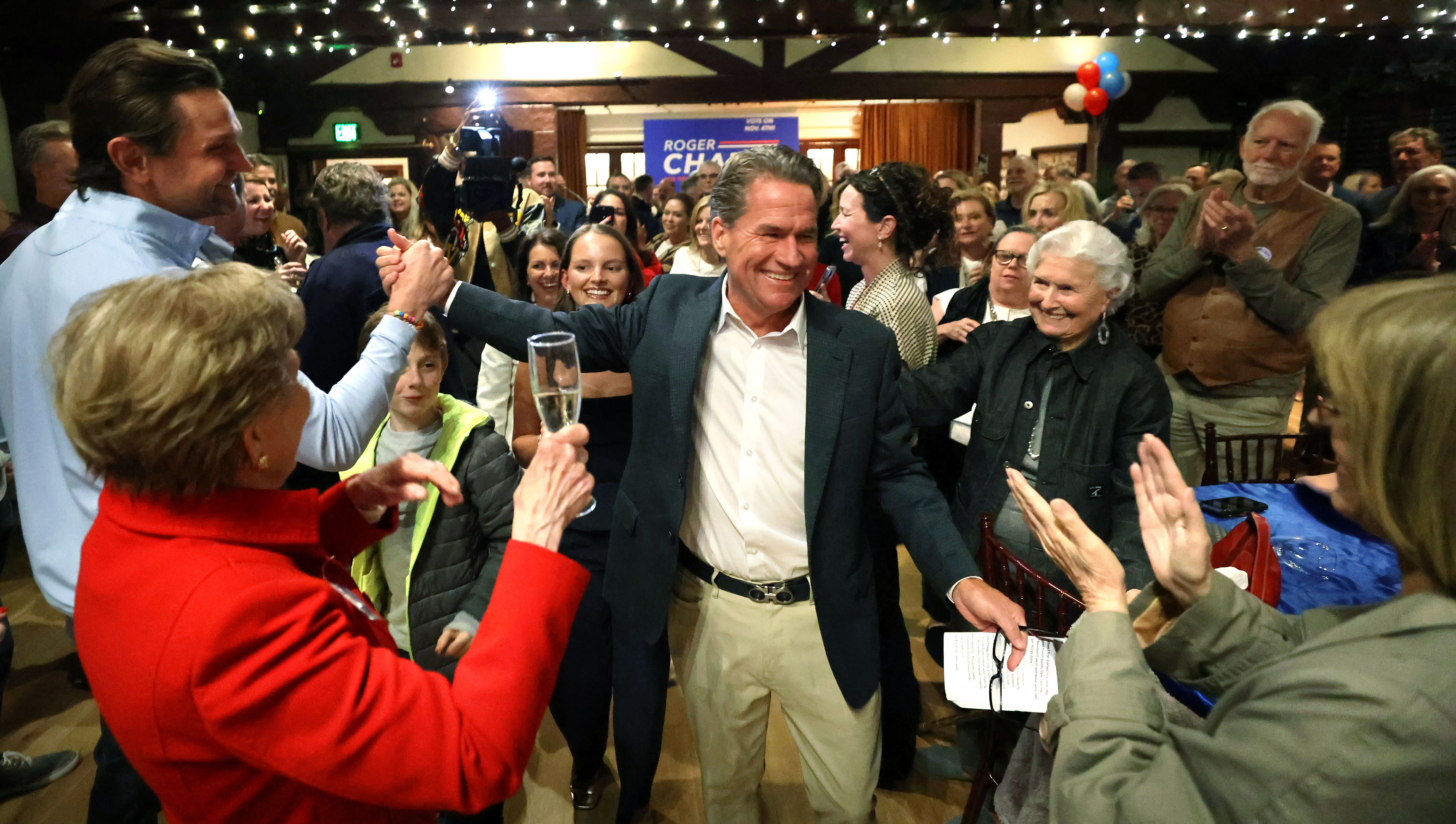 City of Orlando District 3 Commissioner-elect Roger Chapin gets a...