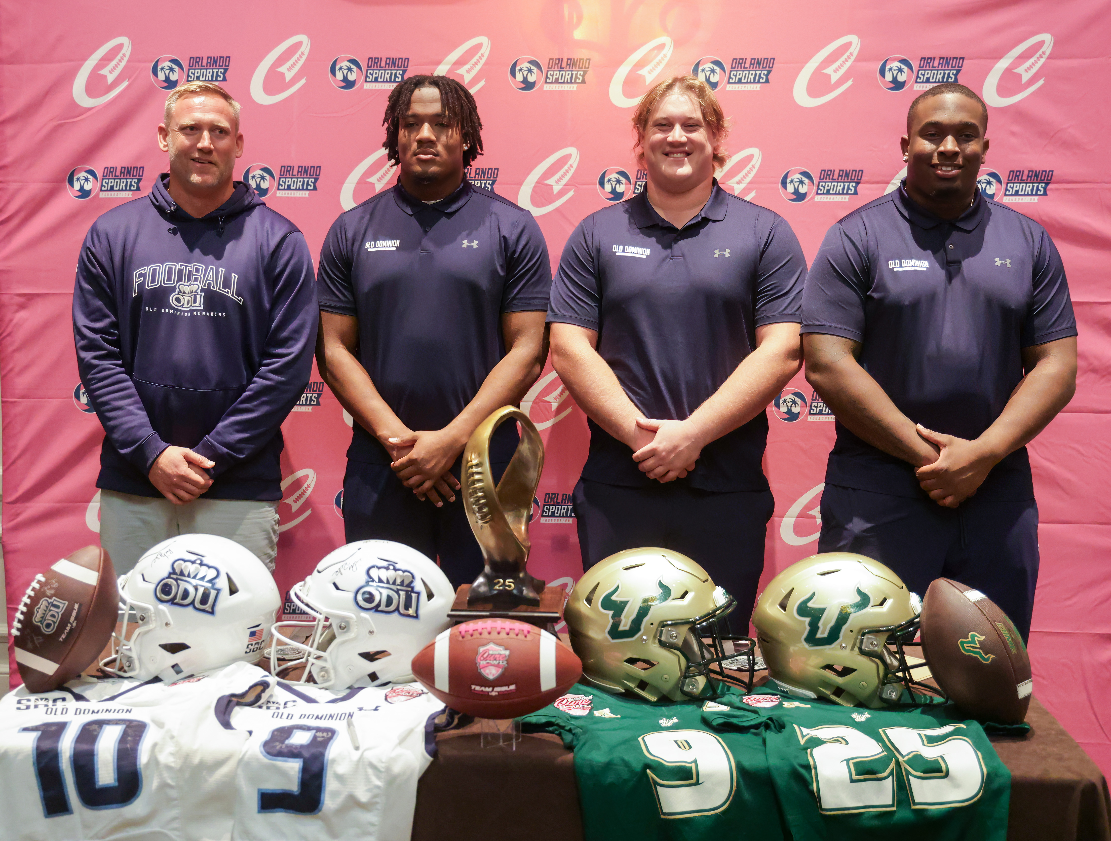 Head coach Ricky Rahne of Old Dominion with players, from...
