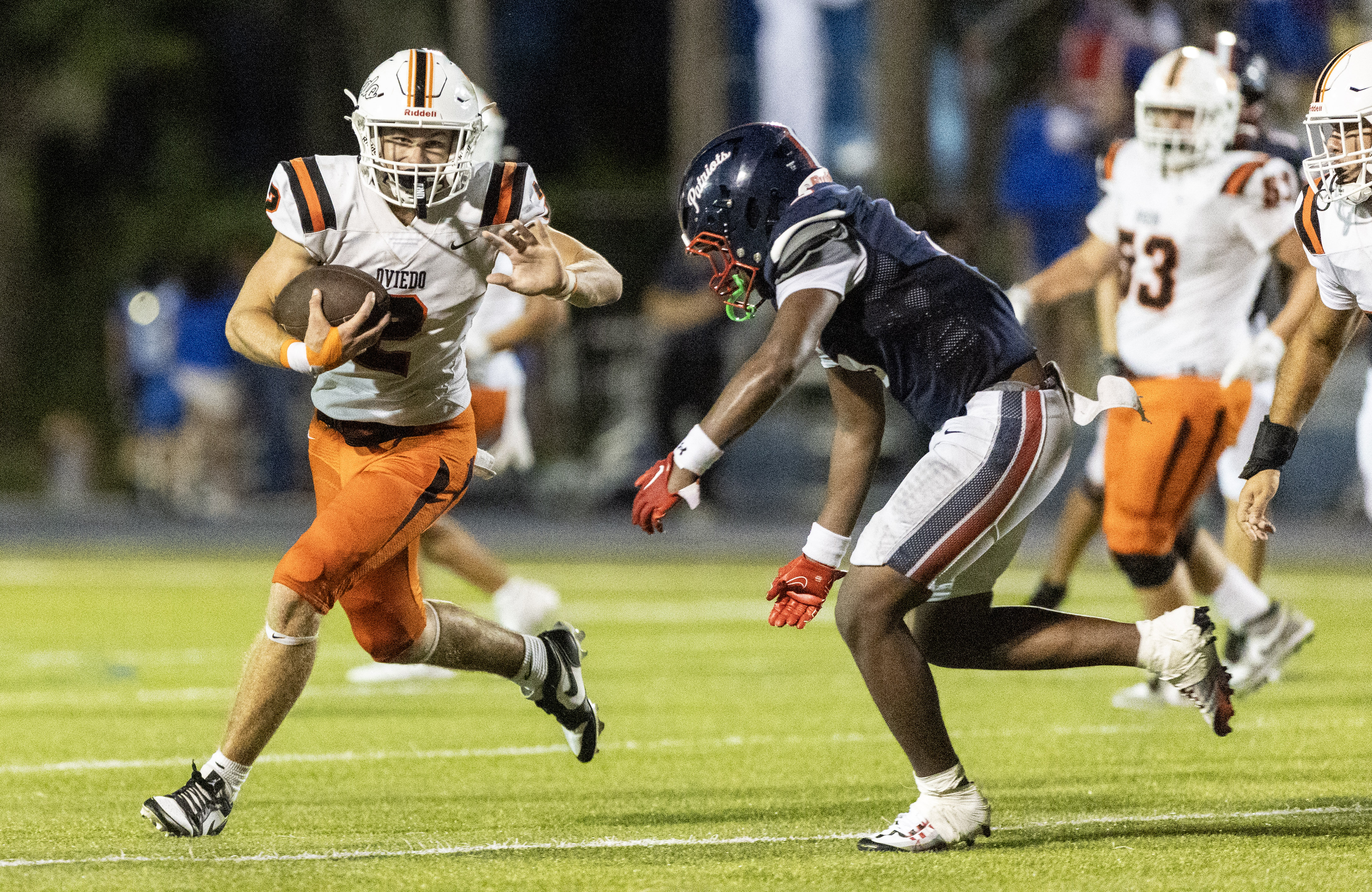 Oviedo High Schoolâs athlete Brock Joyce (2) breaks into the...