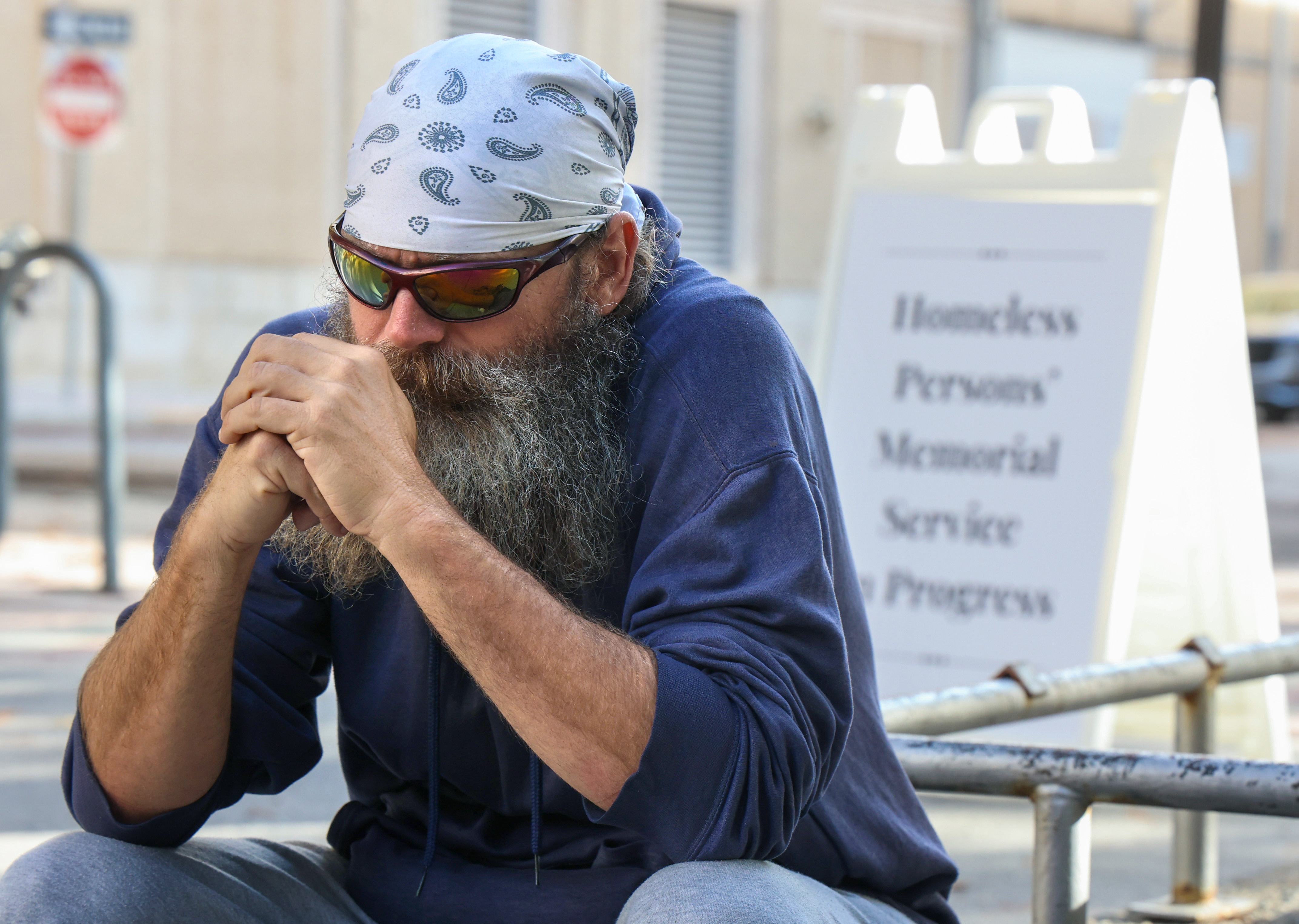 REMEMBERING THE HOMELESS â An observer prays during the annual...