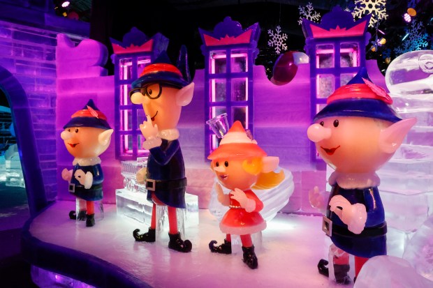 Elves in Santa's workshop at ICE! Featuring Rudolph the Red-Nosed Reindeer at Gaylord Palms, pictured on Thursday, Nov. 13, 2025. The holiday attraction features 11 colorful scenes from the holiday animated classic, all sculpted from ice. (Rich Pope/Orlando Sentinel)