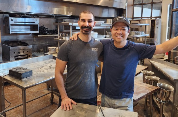 Chef/Partner Michael Cooper and Owner Jason Chin strike a pose during the remodel of Osteria Ester, now operating in the Thornton Park space where Soco used to be. It was the second new restaurant for Good Salt Restaurant Group in 2025. (Courtesy Good Salt Restaurant Group)