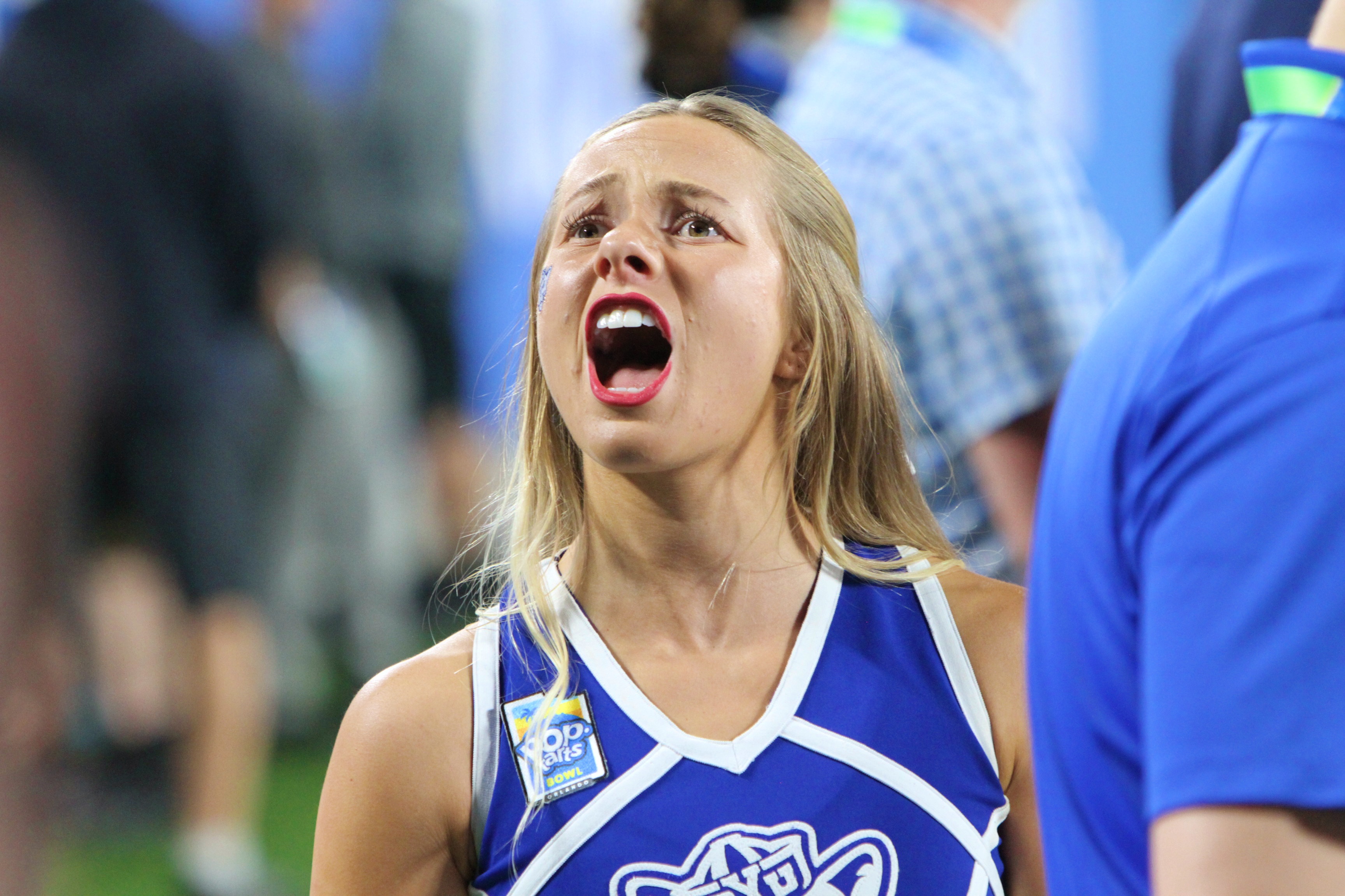A BYU cheerleader offers her team encouragement during Georgia Tech's...