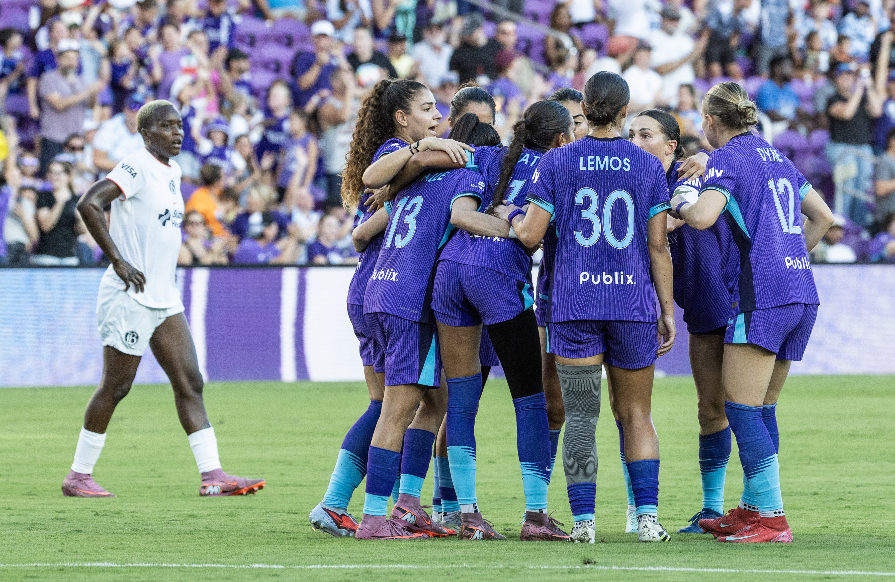 Orlando Pride players huddle up after tying the score 1-1...