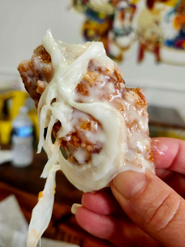 Red hot pepper wings with snow onion topping: craveability is off the charts. (Amy Drew Thompson/Orlando Sentinel)