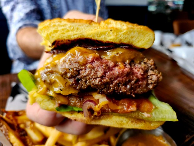 The Palm Beach Meats burger, medium-rare, with a bacon add that it totally doesn't need. I just wanted to try it without having to order a whole other sandwich. I am only barely able to refrain from using the F word in this caption. (Amy Drew Thompson/Orlando Sentinel)