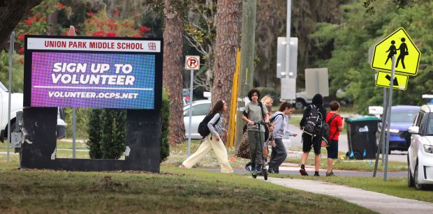 Students leave campus at the end of the school day at Union Park Middle School, Tuesday, Dec. 9, 2025. The Orange County Public Schools administration is considering closing seven schools in the district at the end of the academic year due to declining enrollment. (Joe Burbank/Orlando Sentinel)