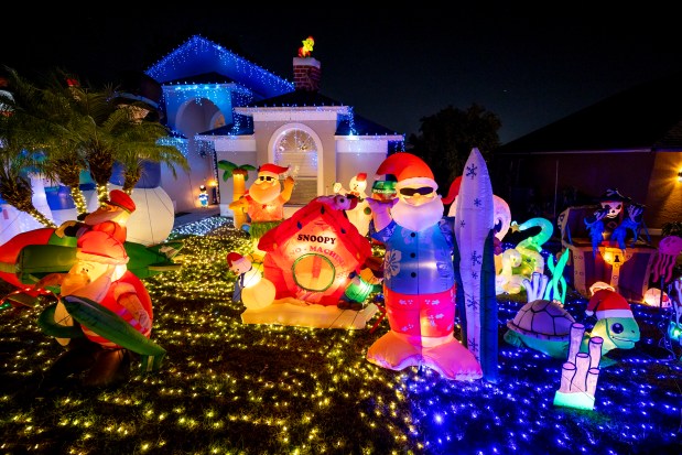 The Lights on Country Run presents a "Battle of the Seasons" with 33 inflatables at 7604 Country Run Parkway in Orlando on Dec. 14, 2025. (Patrick Connolly/Orlando Sentinel)